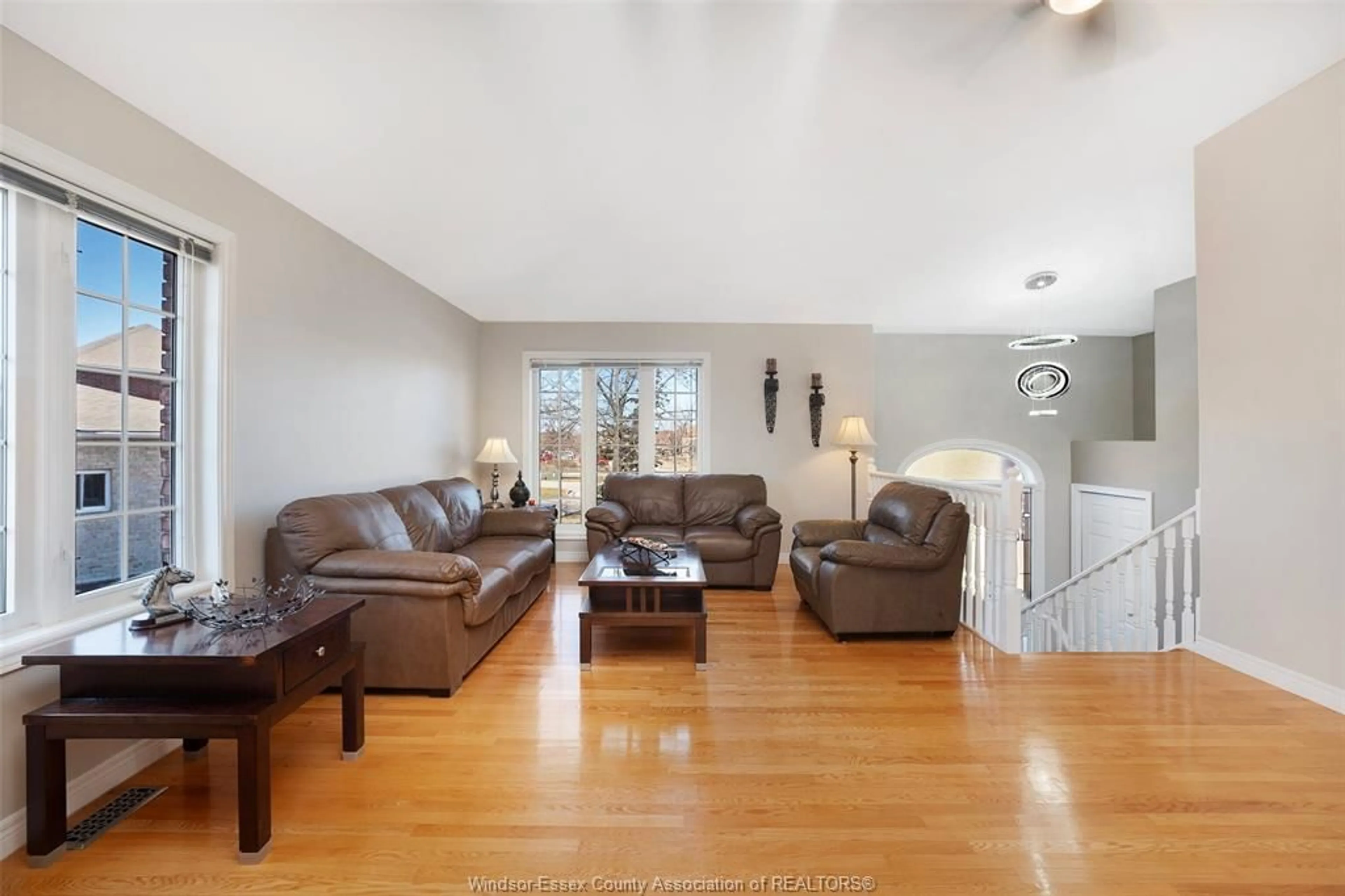 Living room with furniture, wood/laminate floor for 2071 EUGENI, Tecumseh Ontario N9K 1B3