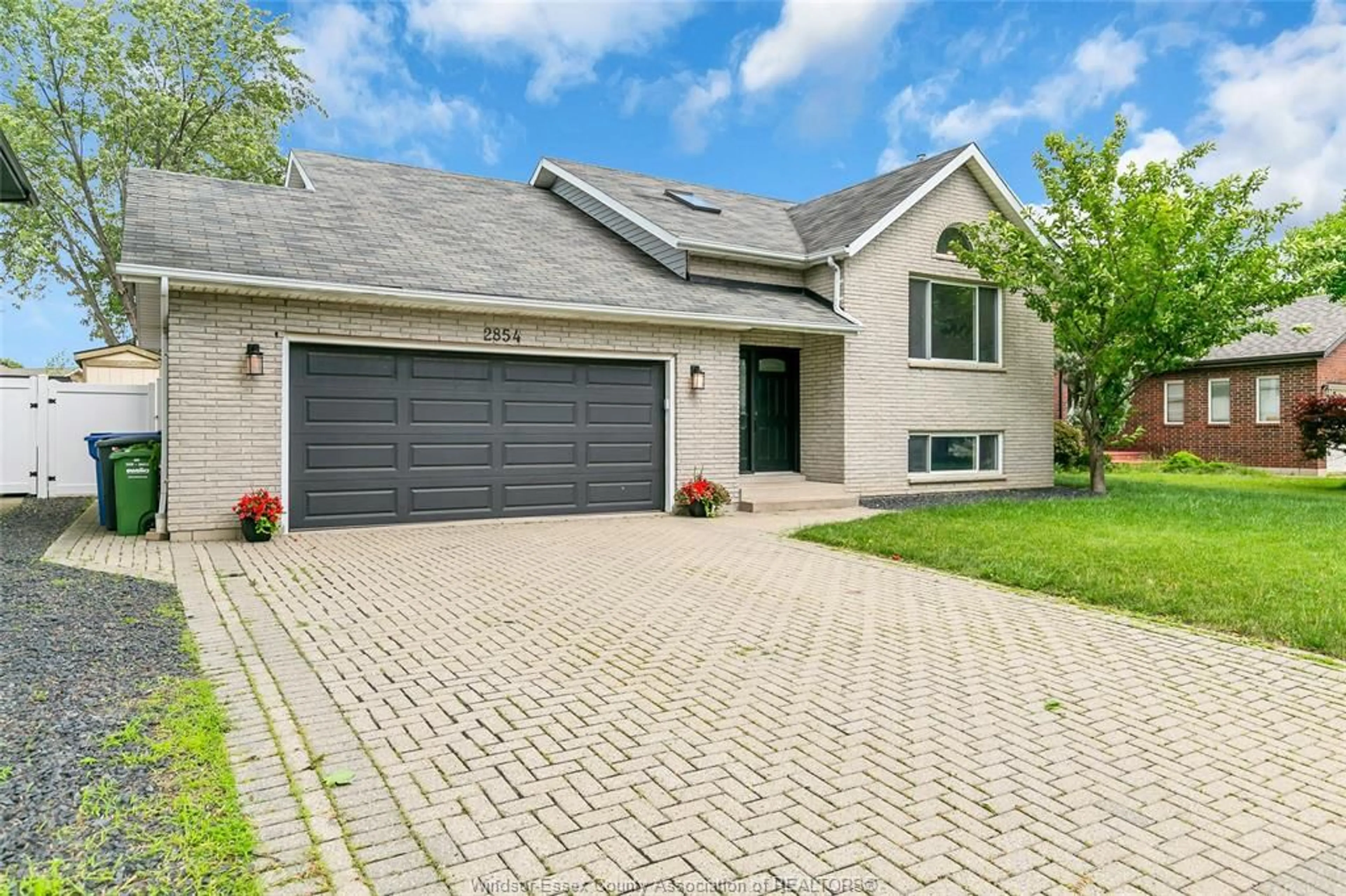 Home with brick exterior material, street for 2854 MANGIN Cres, Windsor Ontario N9E 4K7