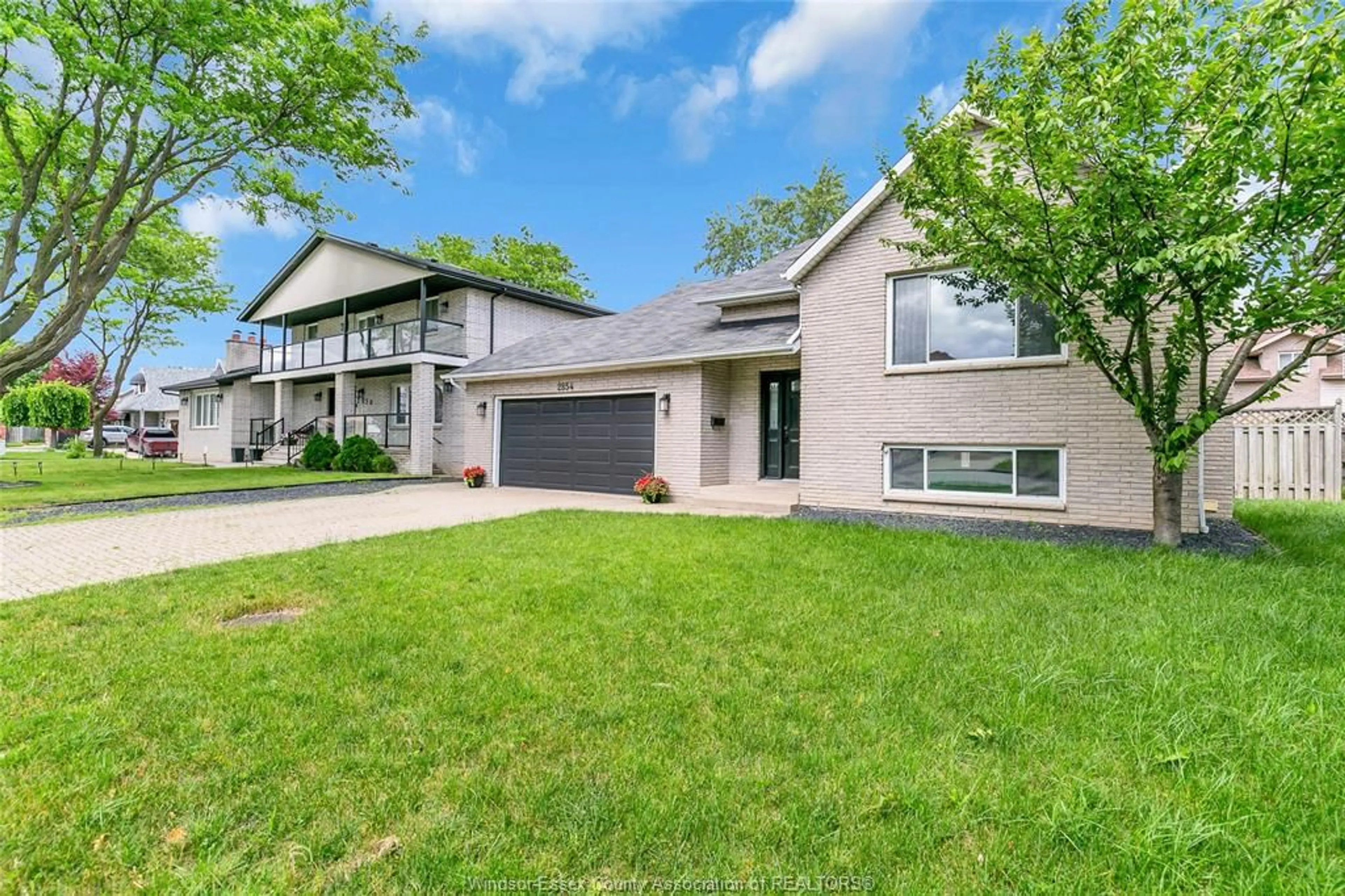 Home with brick exterior material, street for 2854 MANGIN Cres, Windsor Ontario N9E 4K7