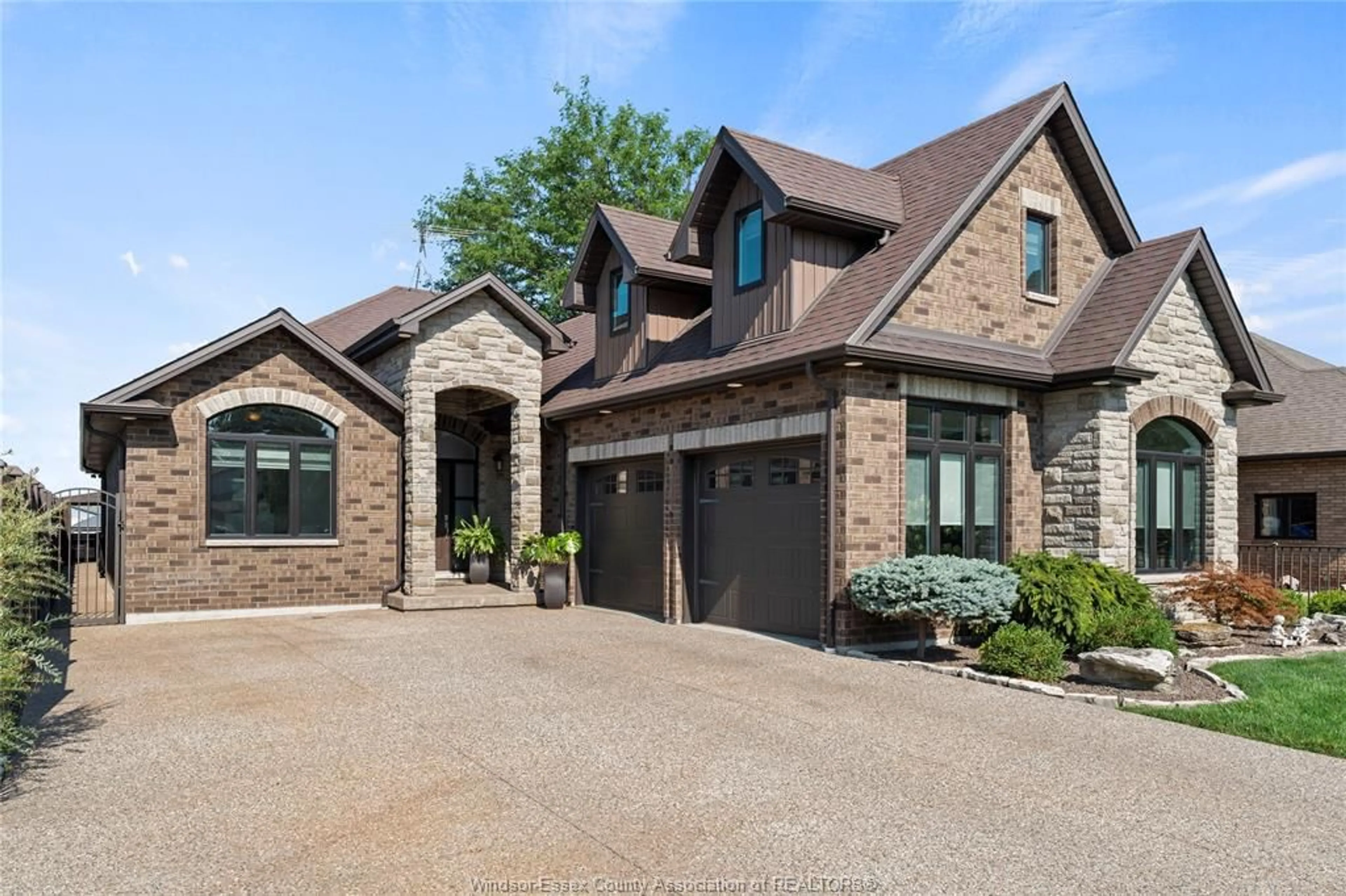 Home with brick exterior material, street for 536 RIVIERA ESTATE Dr, Belle River Ontario N8L 0L4