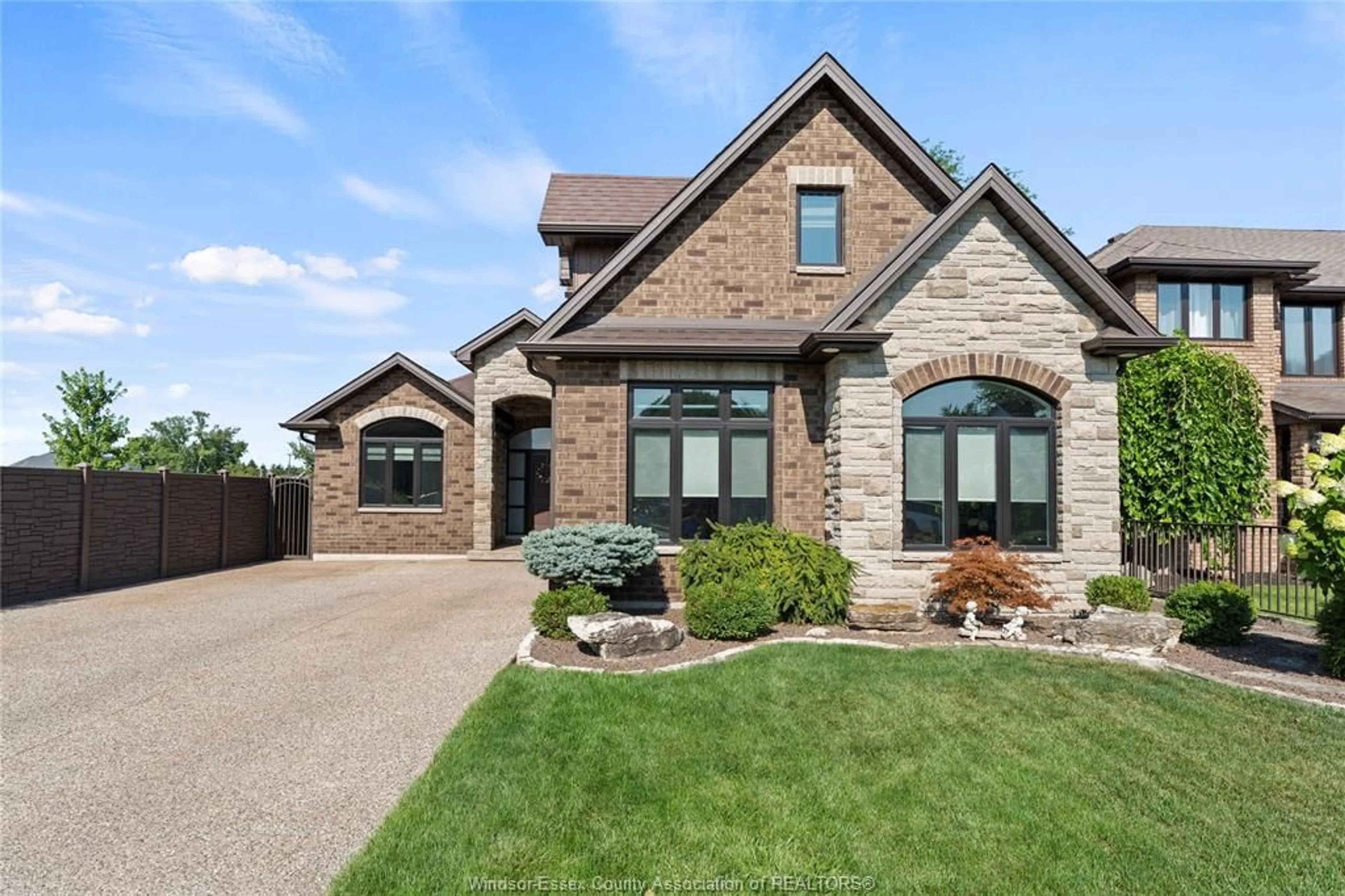 Home with brick exterior material, street for 536 RIVIERA ESTATE Dr, Belle River Ontario N8L 0L4