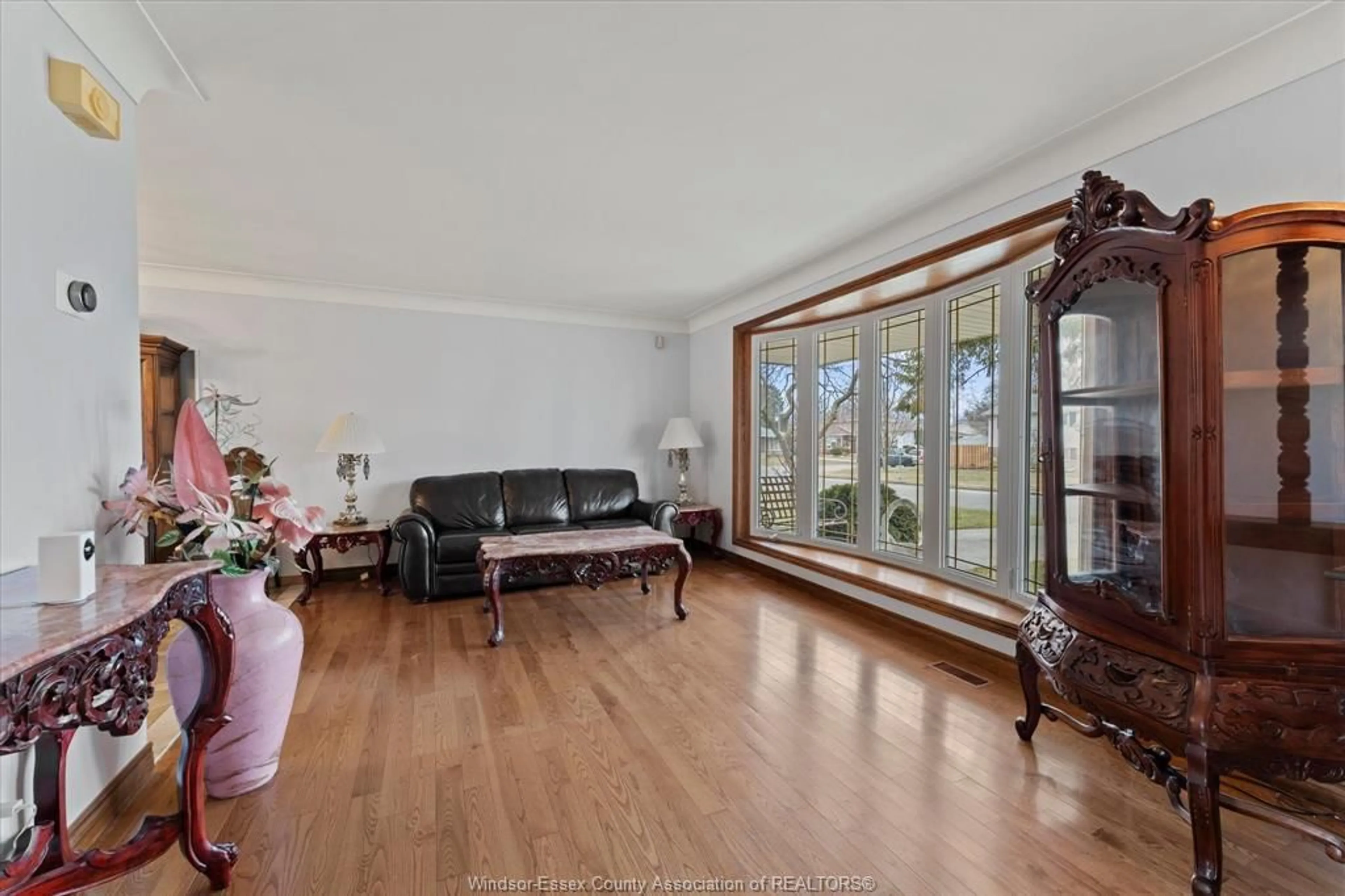 Living room with furniture, wood/laminate floor for 1116 SUMACH Cres, Windsor Ontario N8S 2S4