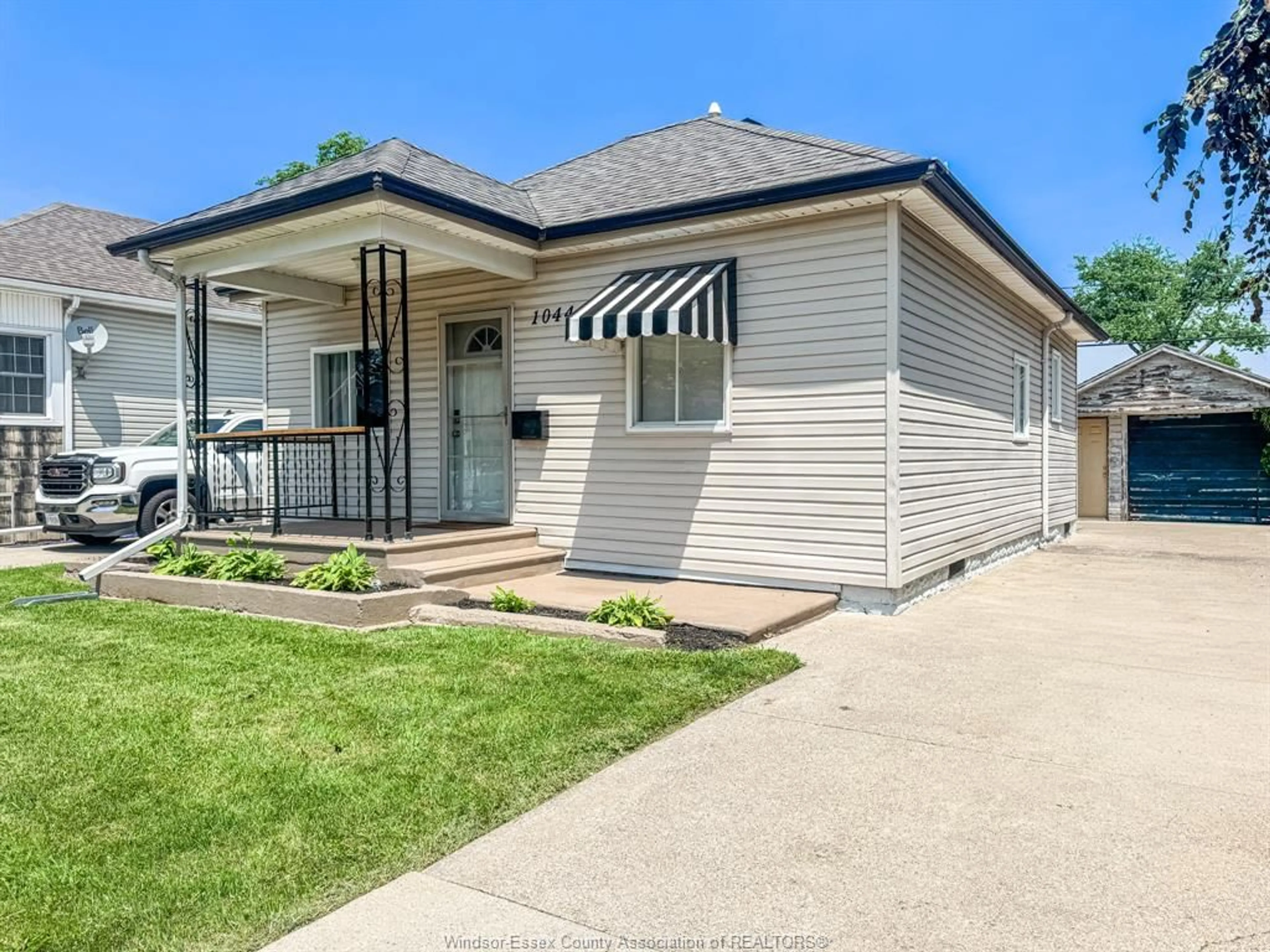 Home with vinyl exterior material, street for 1044 Reedmere Rd, Windsor Ontario N8S 2M1