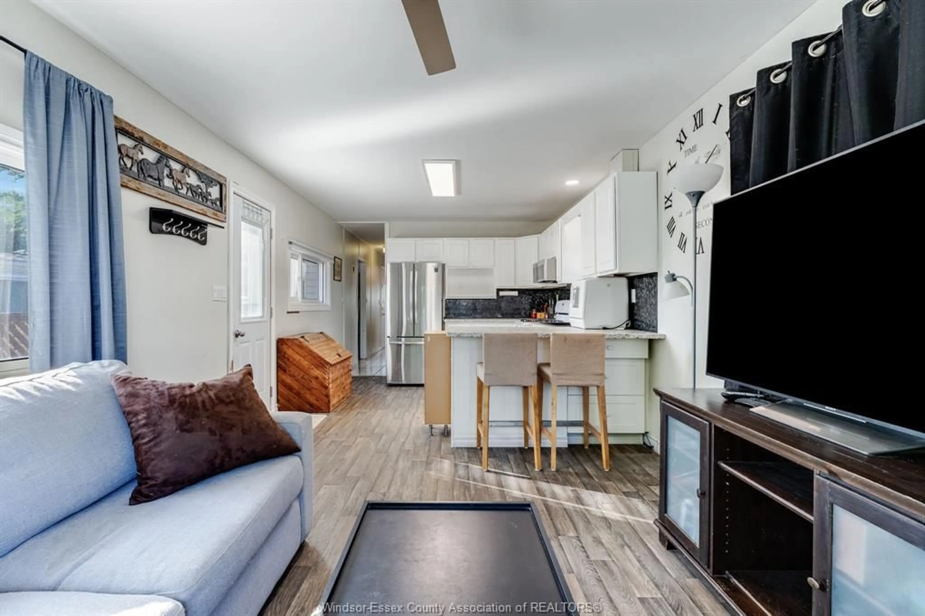 Open concept kitchen, wood/laminate floor for 29 Parkside Dr, McGregor Ontario N0R 1J0