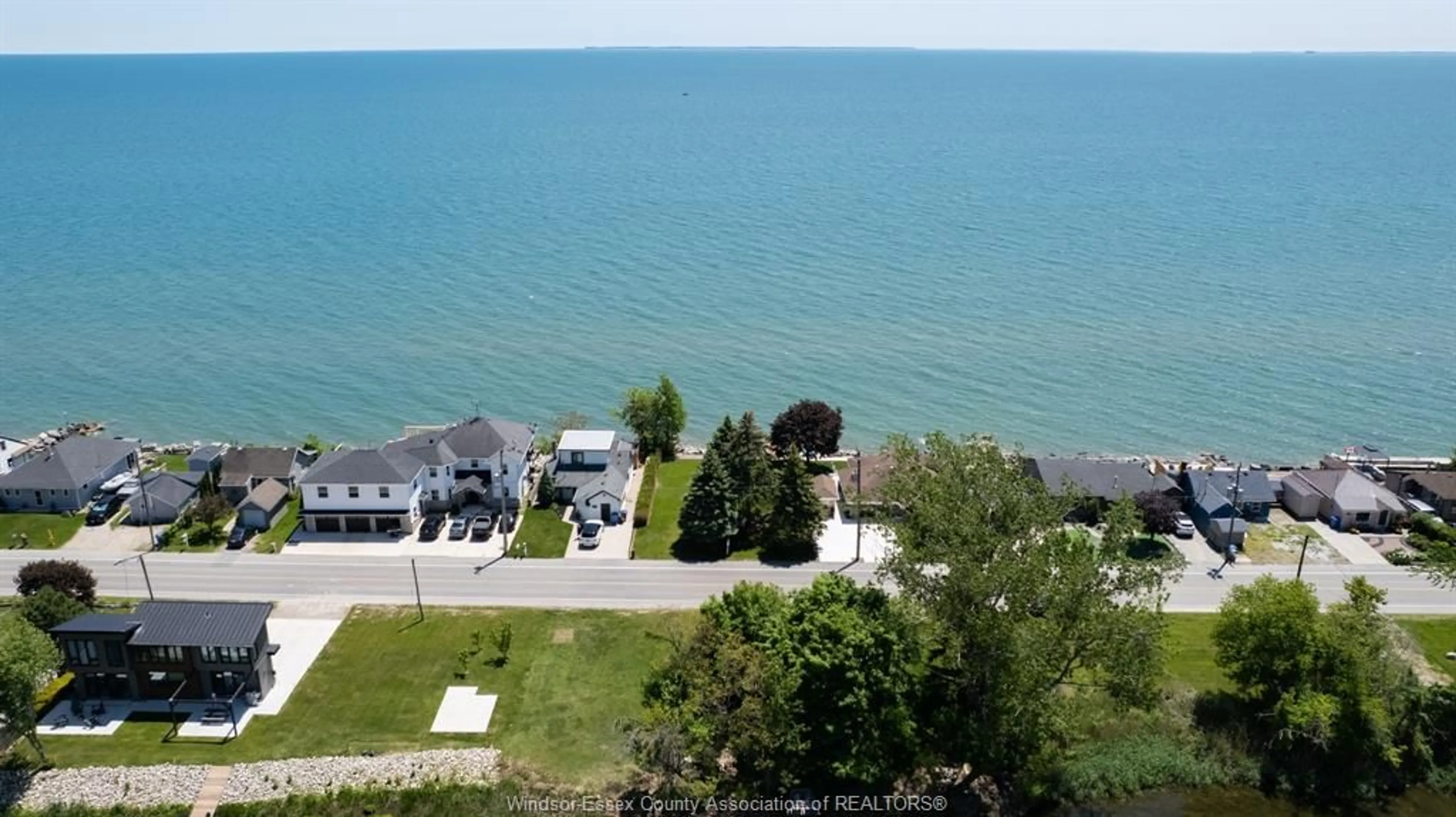 A pic from outside/outdoor area/front of a property/back of a property/a pic from drone, water/lake/river/ocean view for 1351 Heritage Rd, Kingsville Ontario N8H 4C9