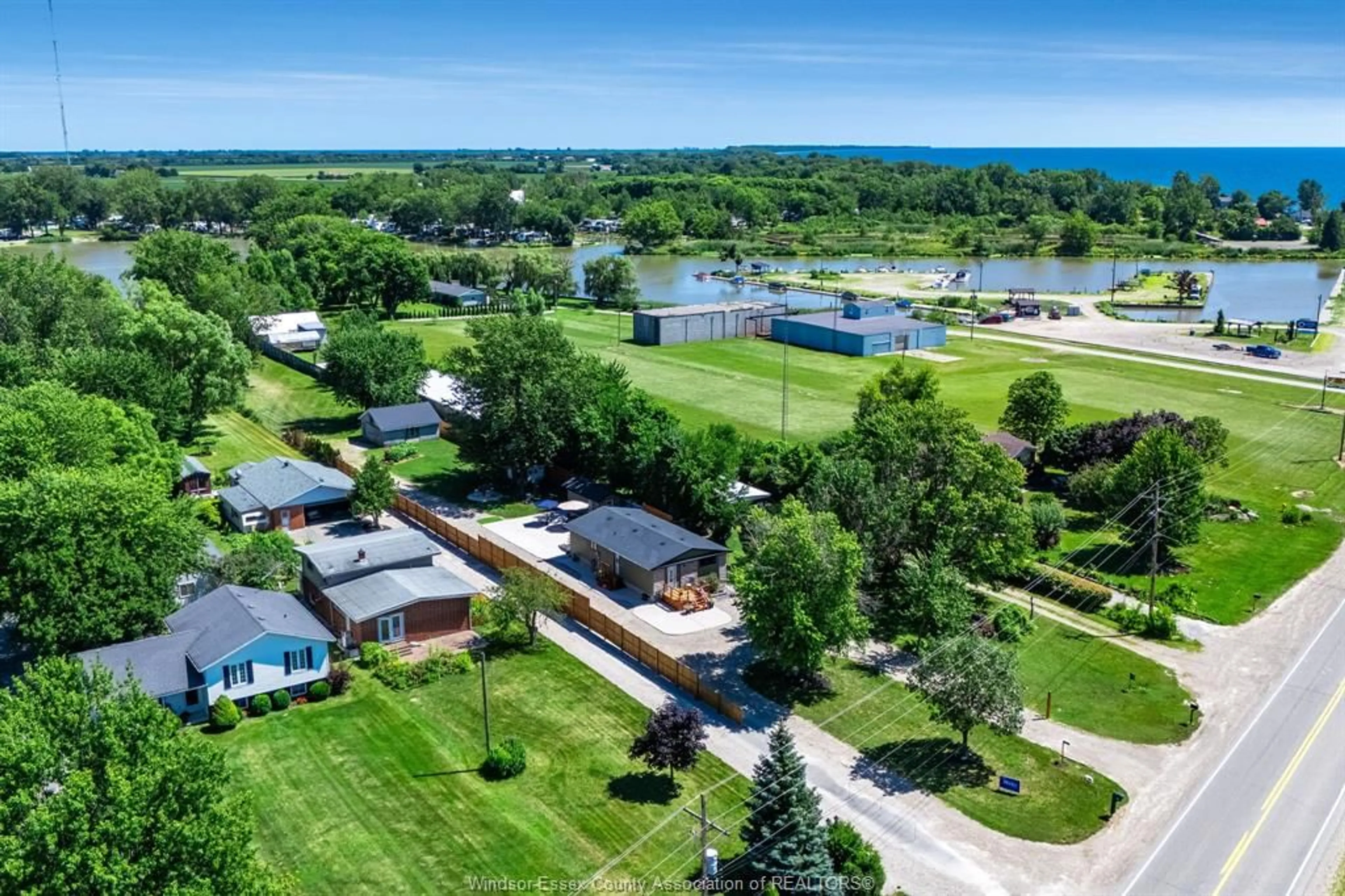 A pic from outside/outdoor area/front of a property/back of a property/a pic from drone, water/lake/river/ocean view for 574 Bevel Line, Leamington Ontario N8H 3V4