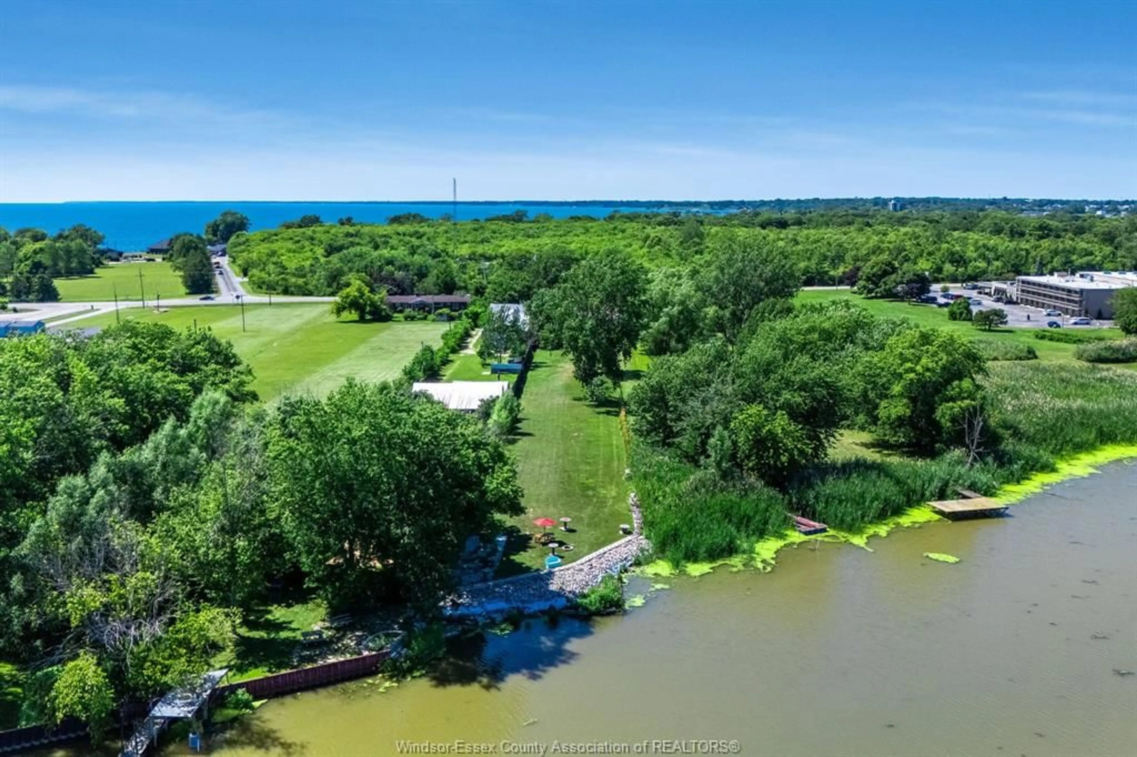 A pic from outside/outdoor area/front of a property/back of a property/a pic from drone, water/lake/river/ocean view for 574 Bevel Line, Leamington Ontario N8H 3V4
