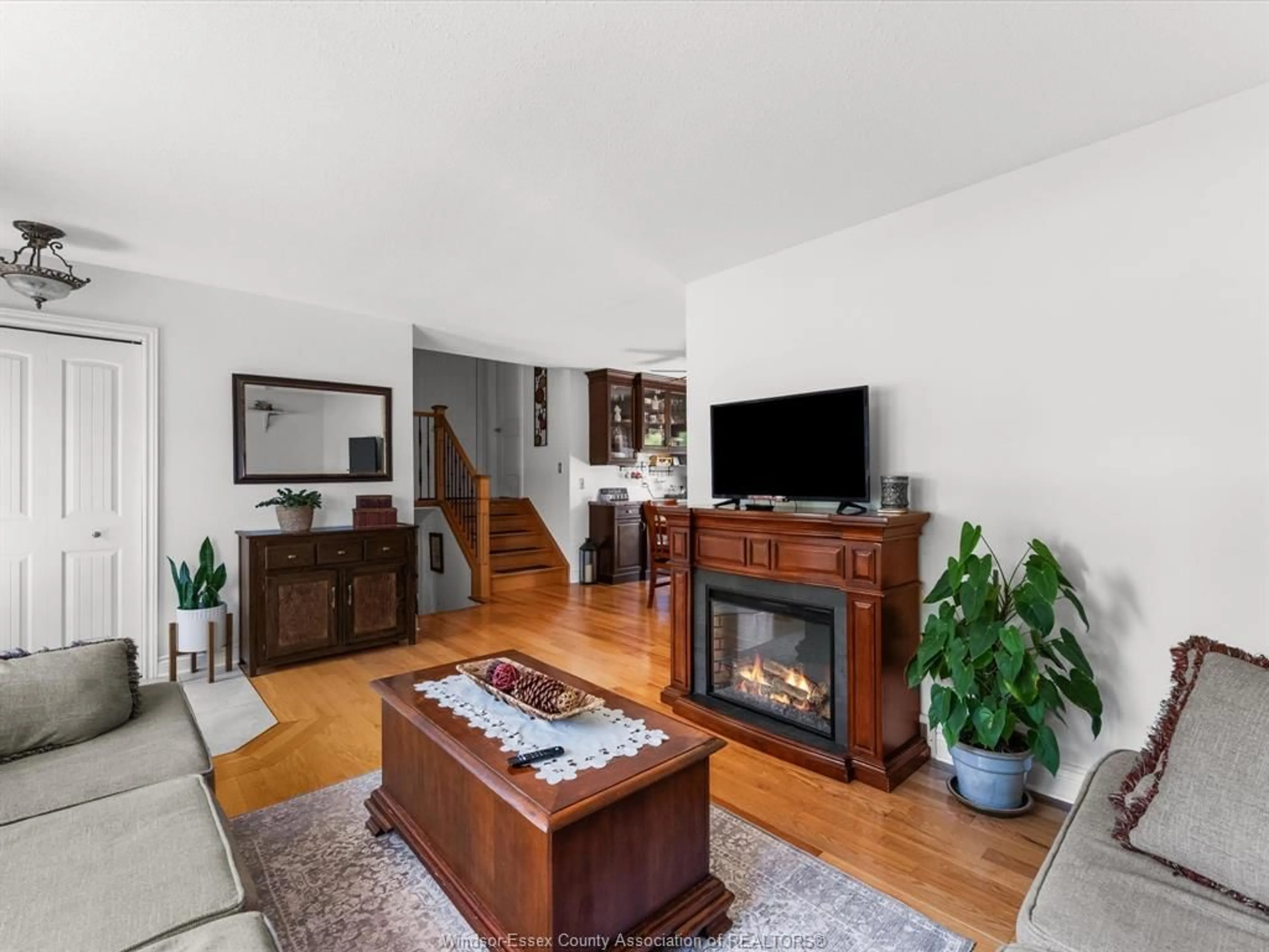 Living room with furniture, wood/laminate floor for 119 Hill St, Cottam Ontario N0R 1B0