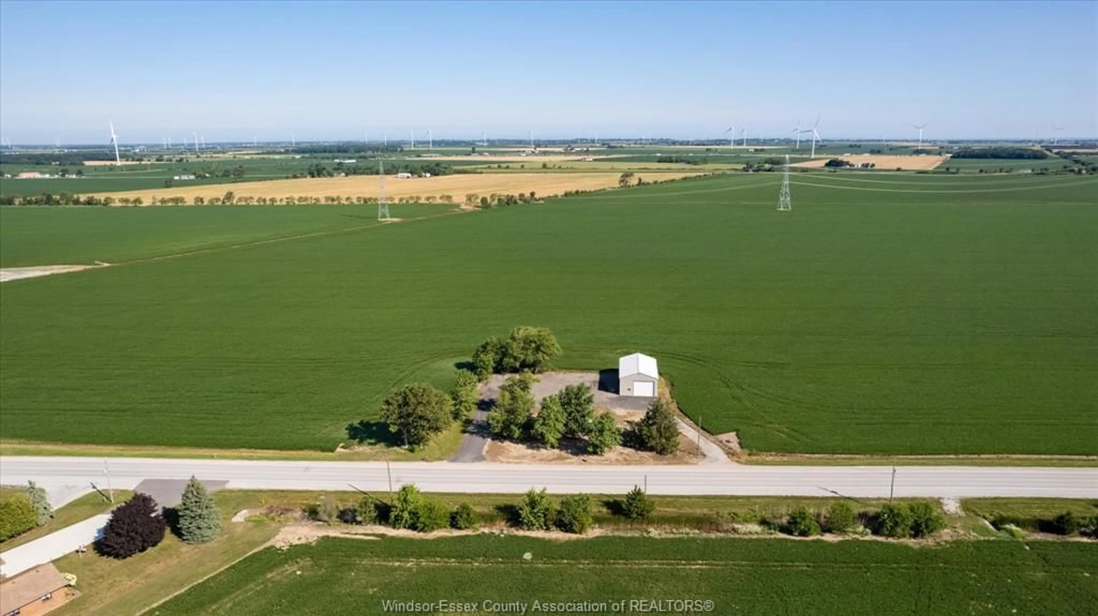 A pic from outside/outdoor area/front of a property/back of a property/a pic from drone, water/lake/river/ocean view for 3500 County Rd 46, Lakeshore Ontario N0P 1J0