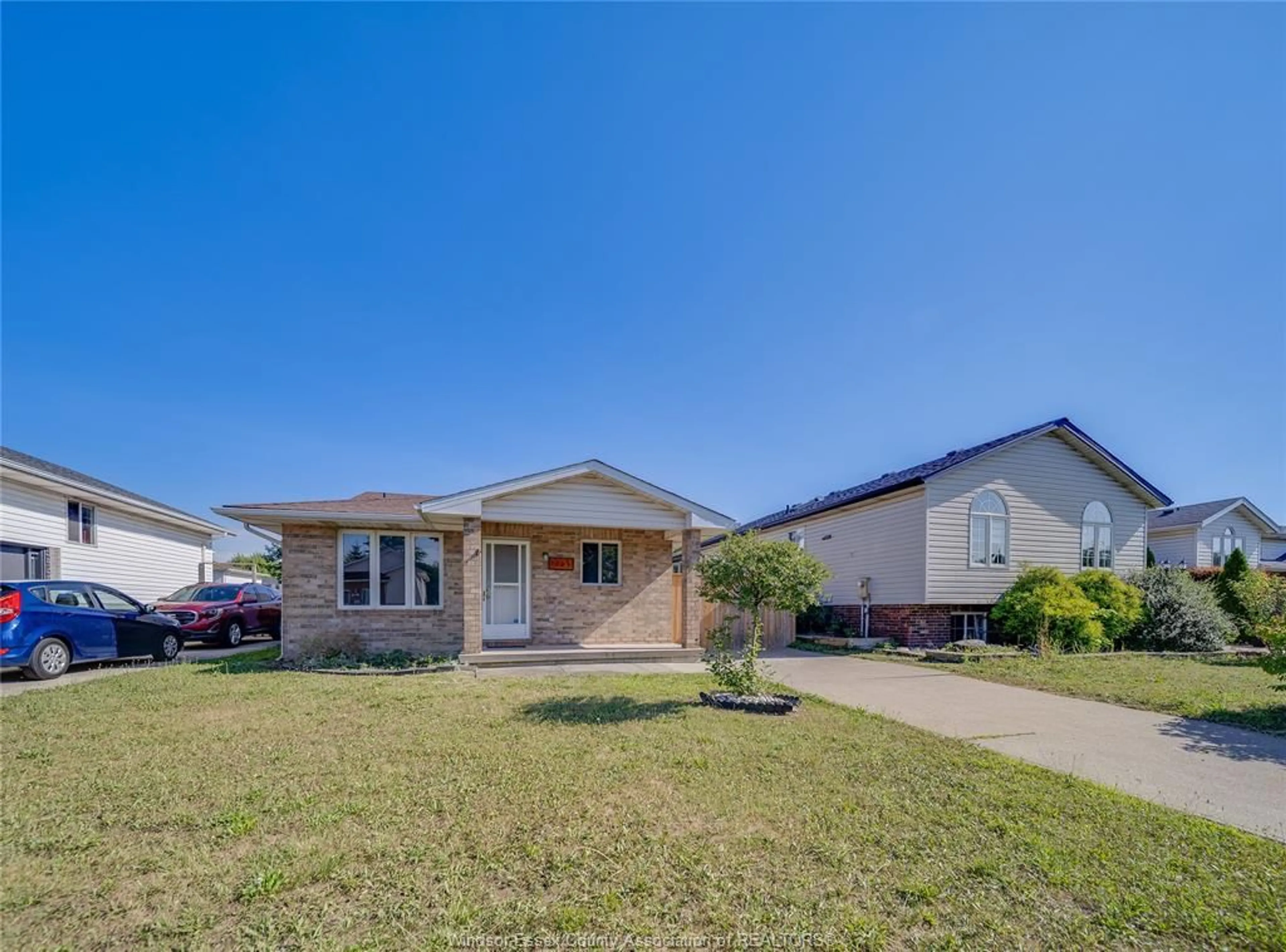 Home with vinyl exterior material, street for 1465 FOSTER Ave, Windsor Ontario N8W 5P8