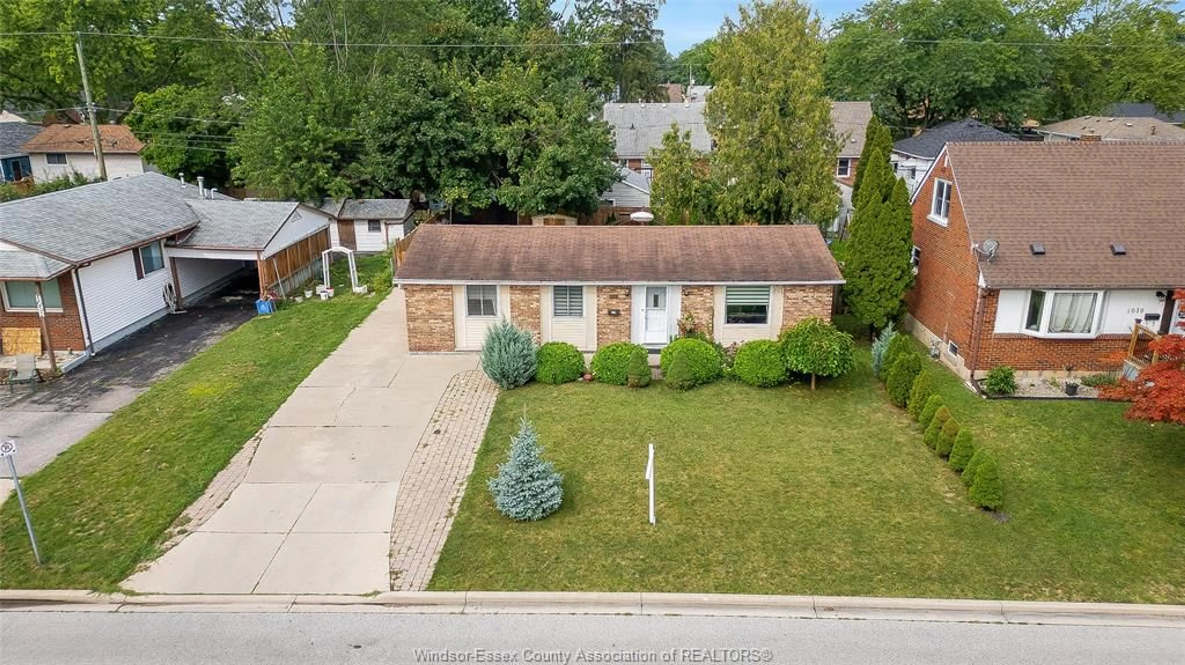 A pic from outside/outdoor area/front of a property/back of a property/a pic from drone, street for 1045 REEDMERE Rd, Windsor Ontario N8S 2L9