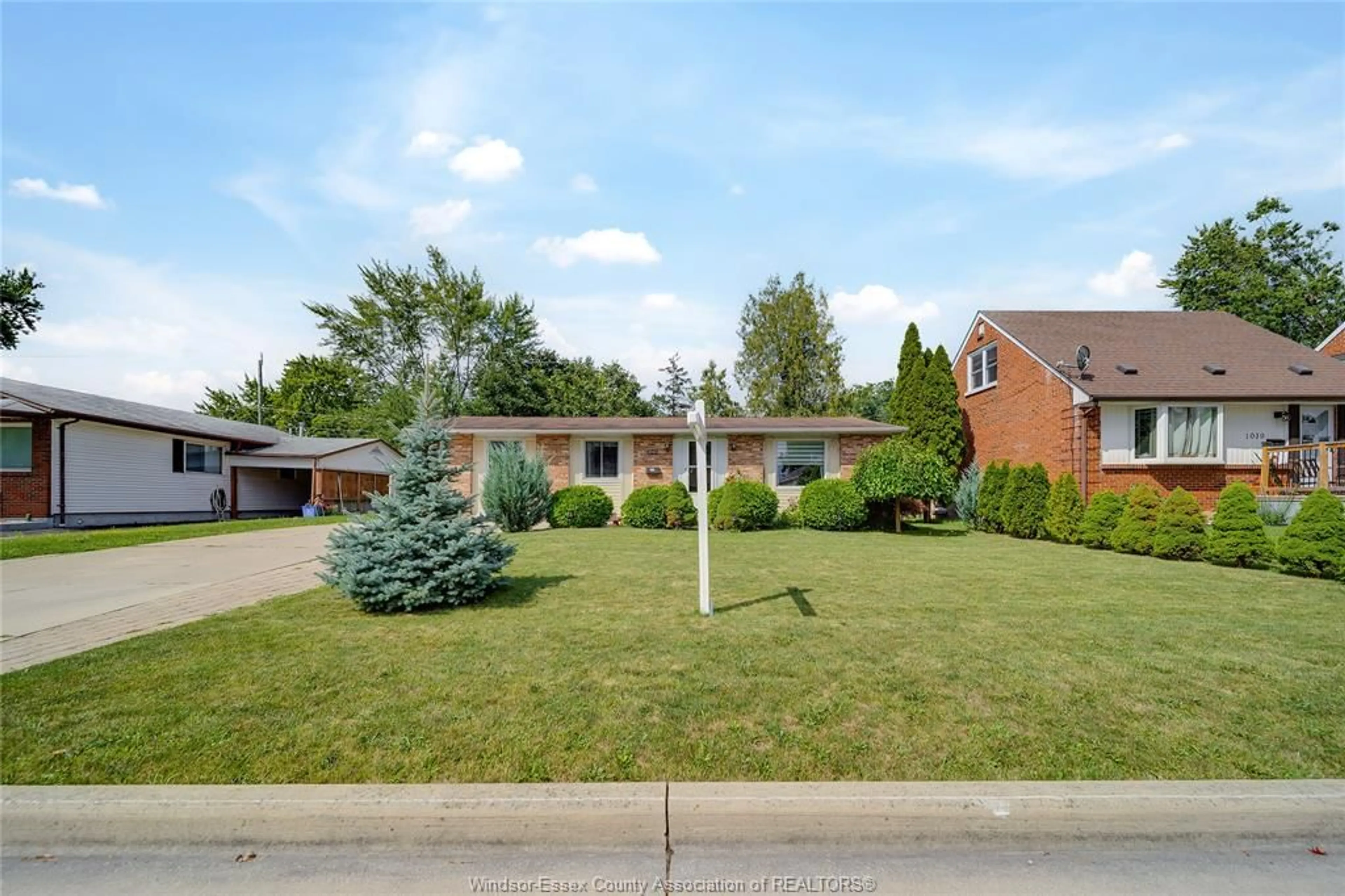 Home with brick exterior material, street for 1045 REEDMERE Rd, Windsor Ontario N8S 2L9