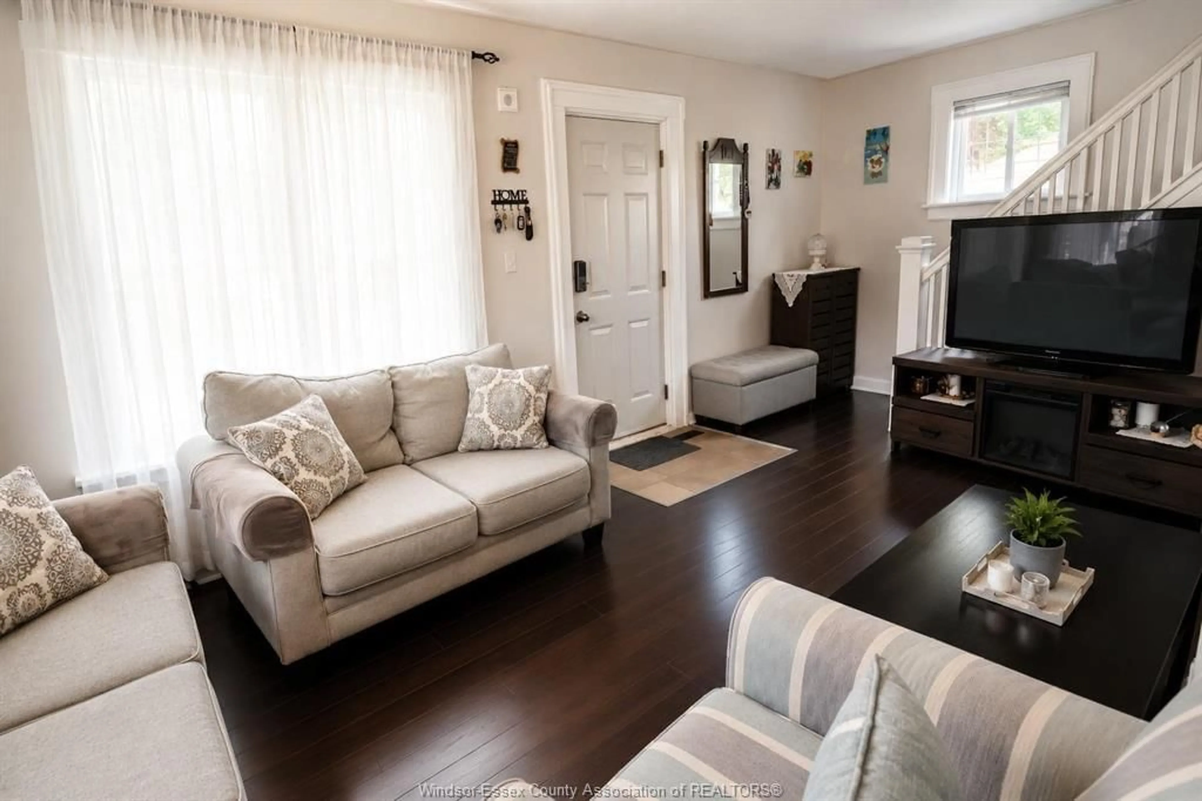 Living room with furniture, wood/laminate floor for 870 SHEPHERD St, Windsor Ontario N8X 2L2