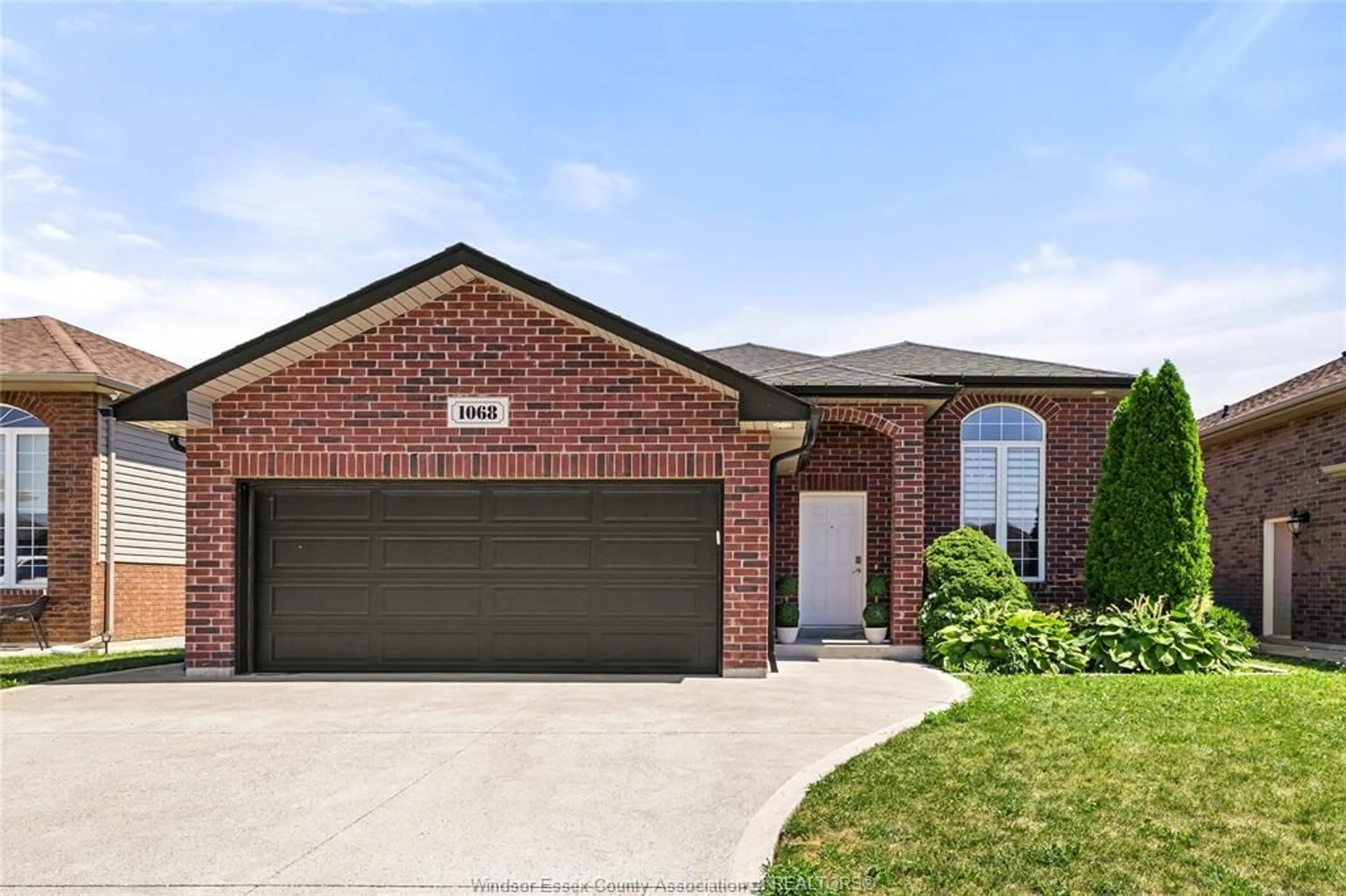 Home with brick exterior material, street for 1068 THUNDERBAY Ave, Windsor Ontario N8P 0C1