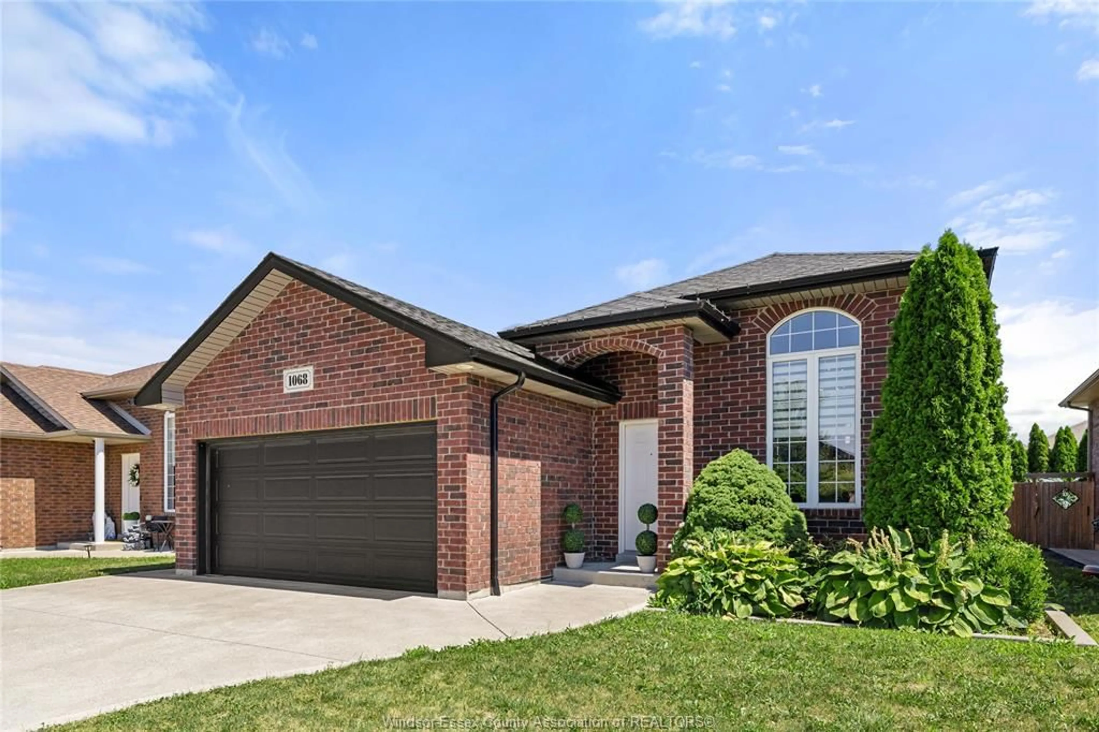 Home with brick exterior material, street for 1068 THUNDERBAY Ave, Windsor Ontario N8P 0C1
