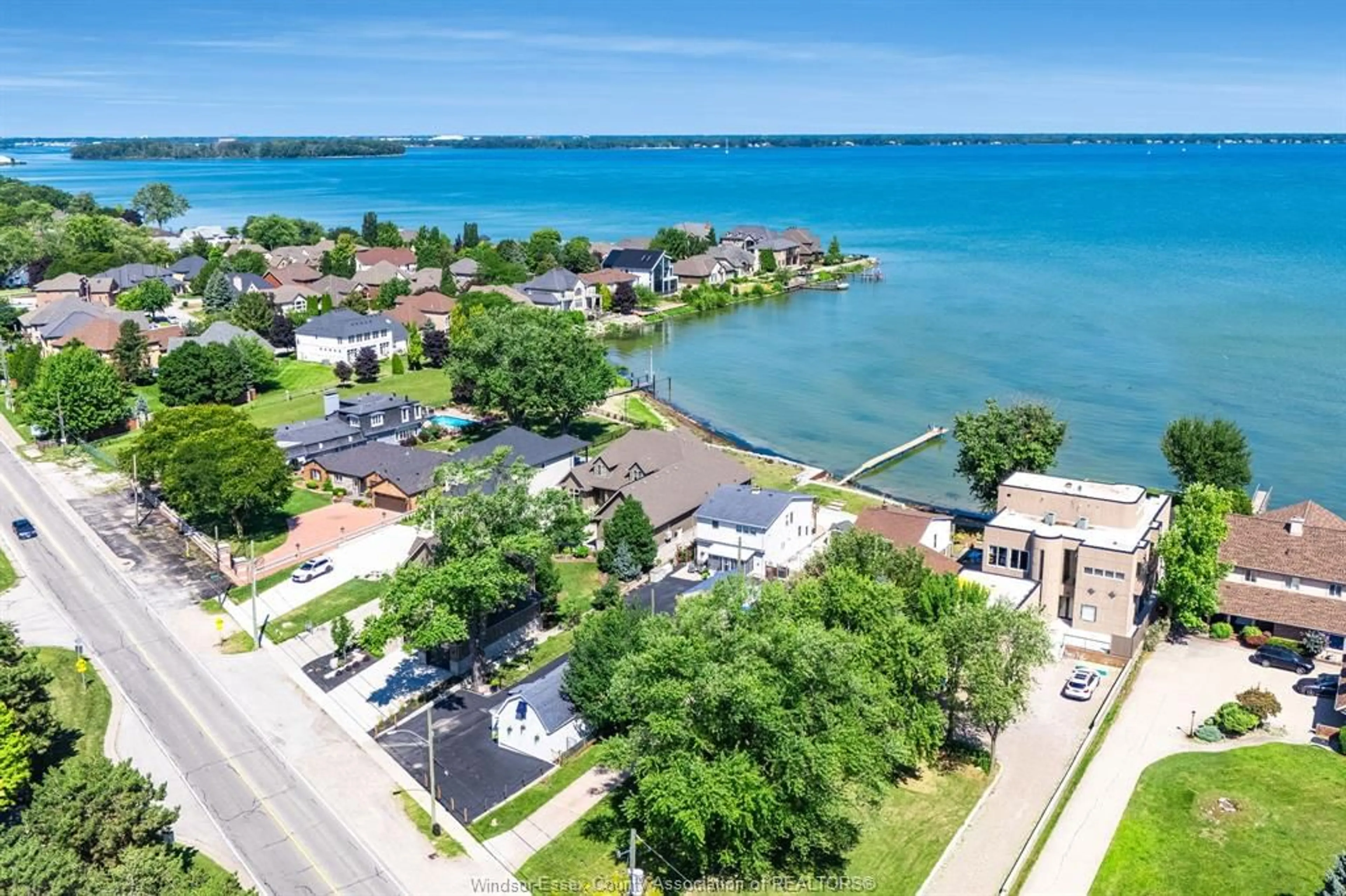 A pic from outside/outdoor area/front of a property/back of a property/a pic from drone, water/lake/river/ocean view for 12086 RIVERSIDE Dr, Tecumseh Ontario N8P 1A9