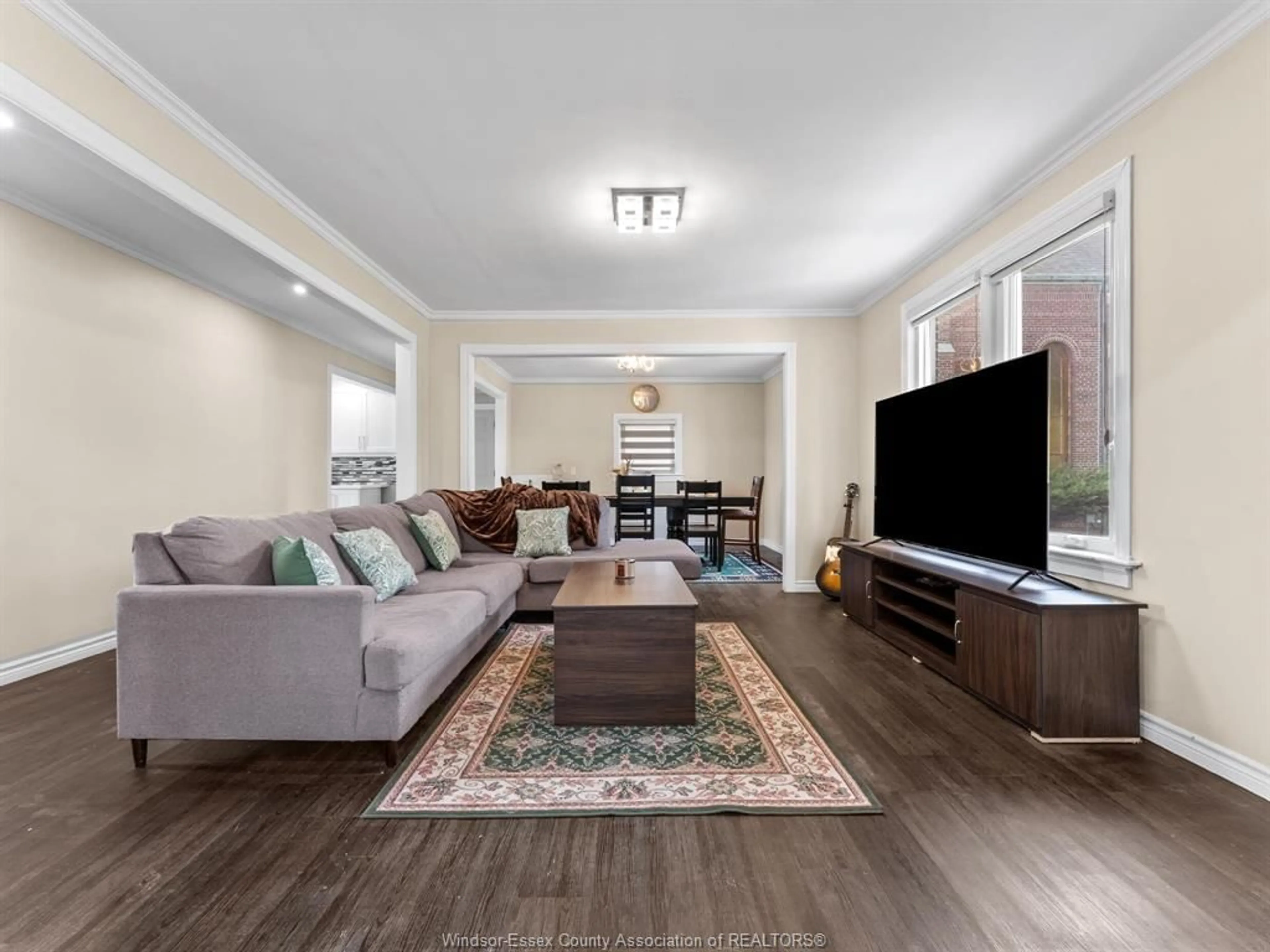 Living room with furniture, wood/laminate floor for 25667 Winterline Rd, Grande Pointe Ontario N0P 1S0