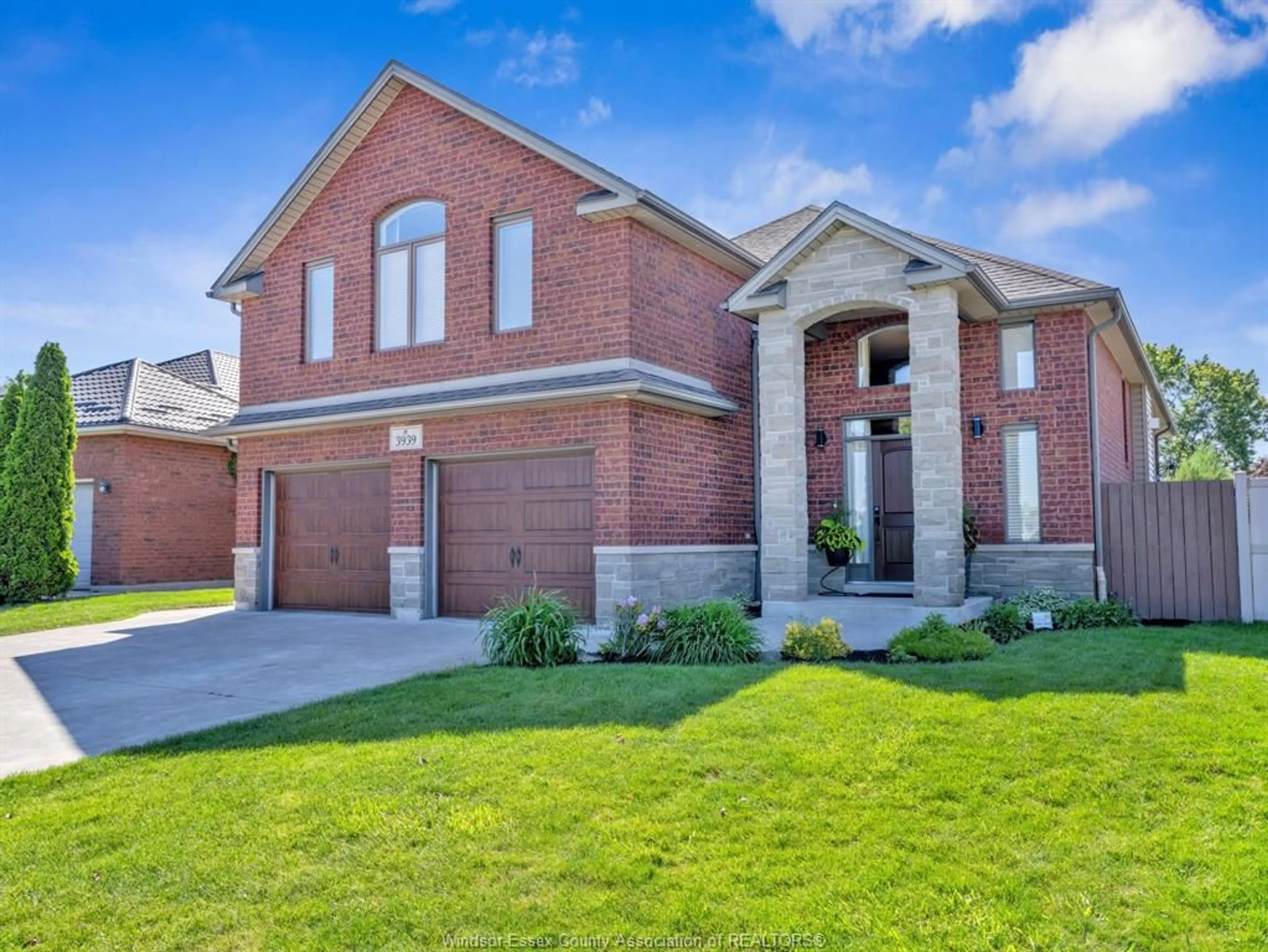 Home with brick exterior material, street for 3939 WILDWOOD Dr, Windsor Ontario N8R 2L4