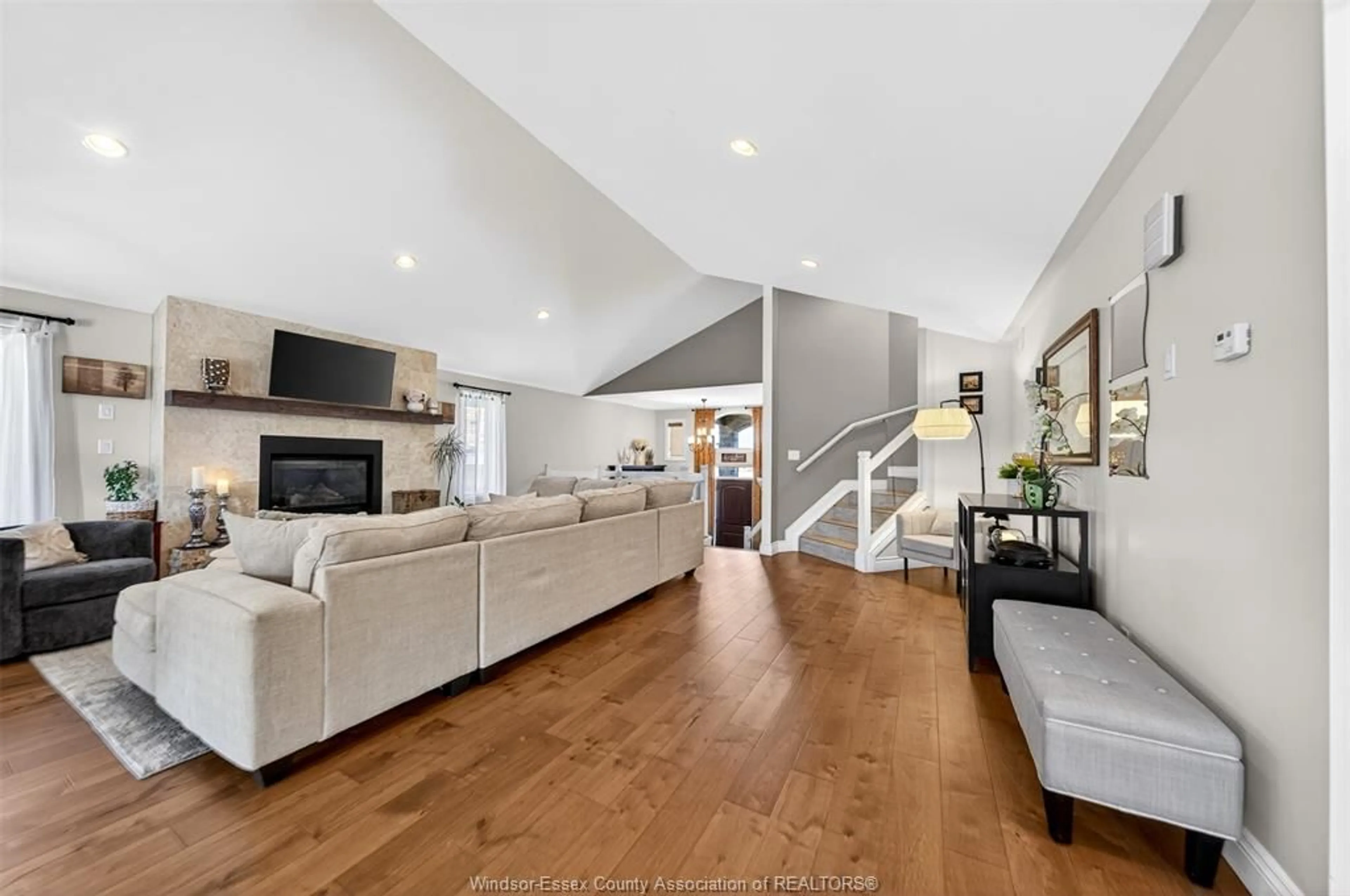 Living room with furniture, wood/laminate floor for 3939 WILDWOOD Dr, Windsor Ontario N8R 2L4