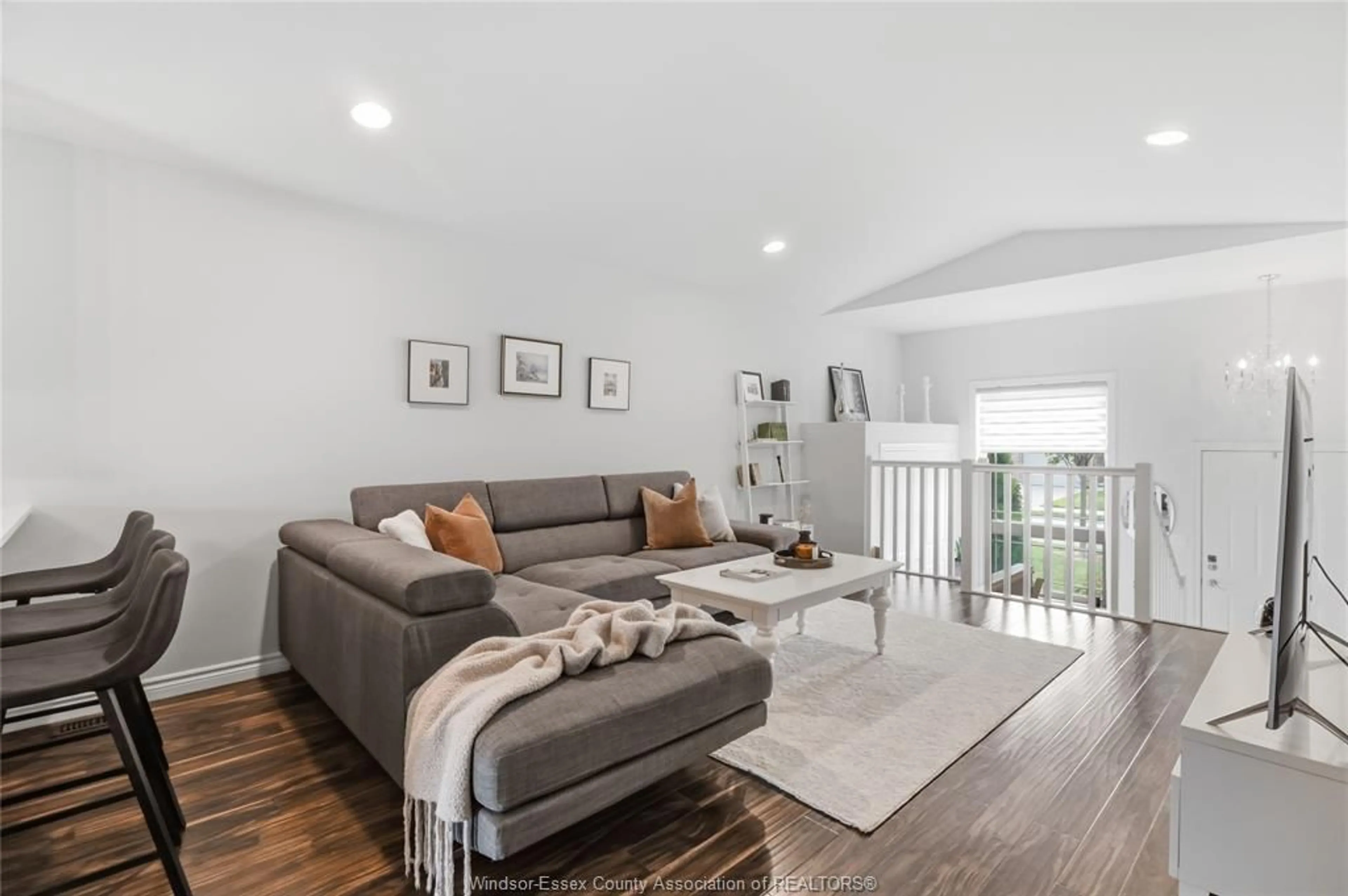 Living room with furniture, wood/laminate floor for 3222 SEVILLE Ave, Windsor Ontario N8N 0A4