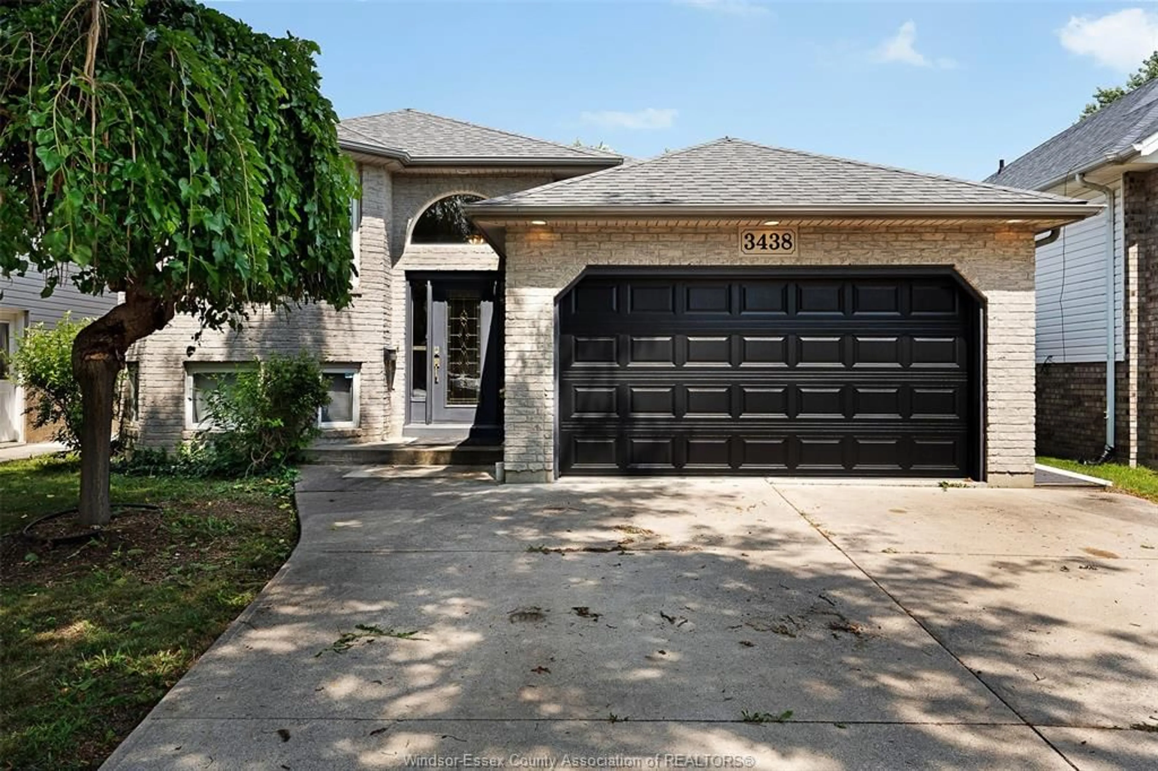 Home with brick exterior material, street for 3438 TREELINE Crt, Windsor Ontario N8R 2K3