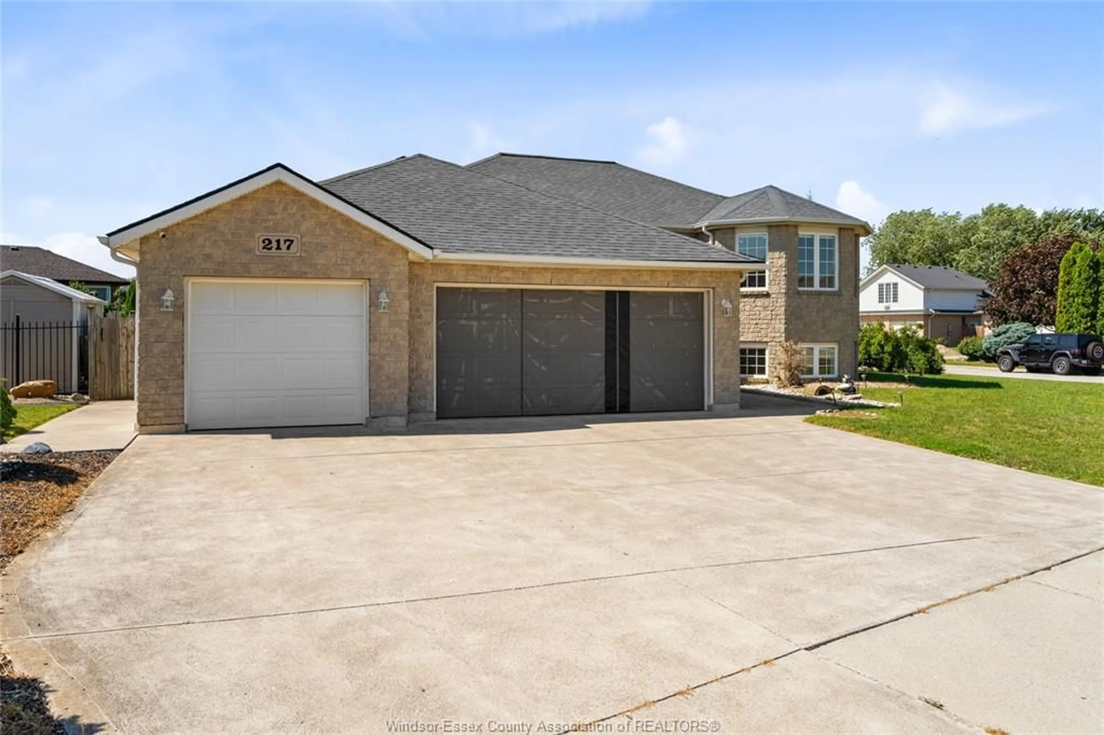 Home with brick exterior material, street for 217 GRANDVIEW Blvd, Lakeshore Ontario N0R 1A0