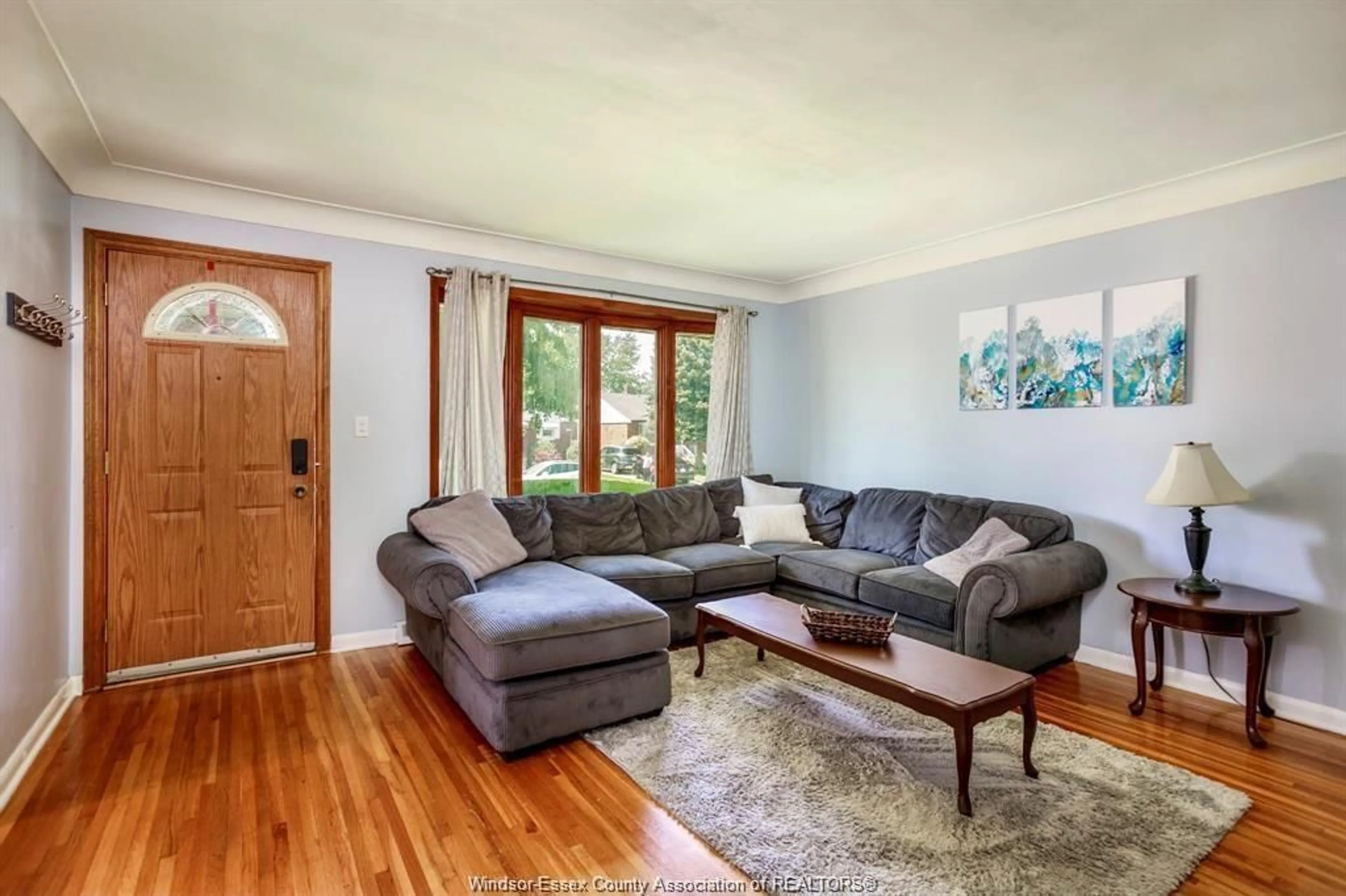 Living room with furniture, wood/laminate floor for 3775 MYRTLE, Windsor Ontario N9C 2C9