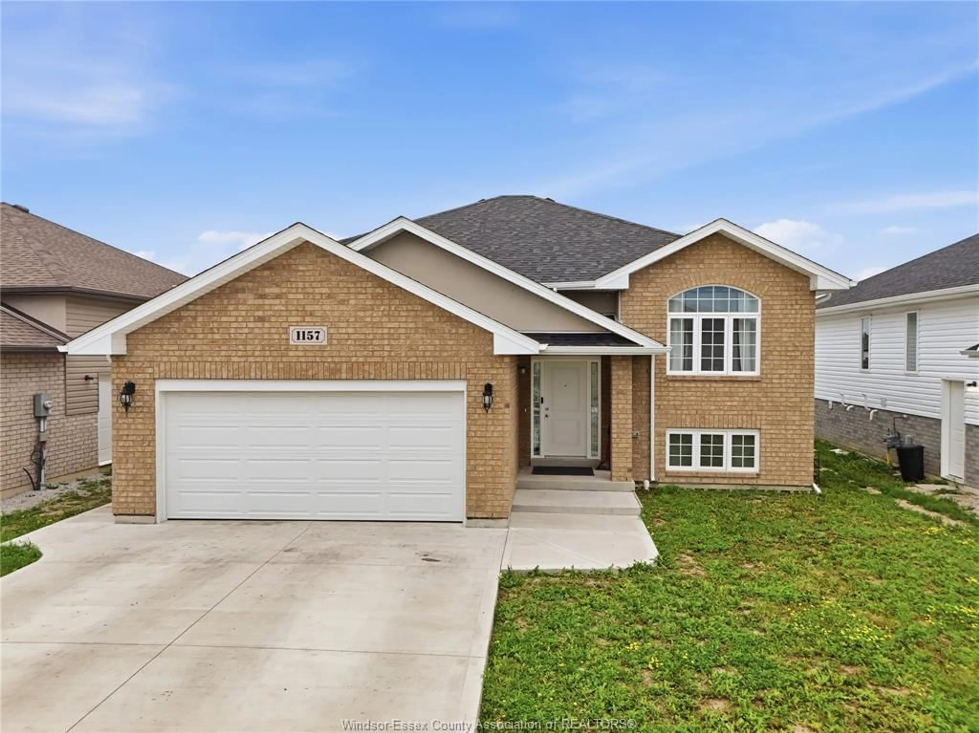 Home with brick exterior material, street for 1157 ASPEN RIDGE Cres, Lakeshore Ontario N0R 1A0