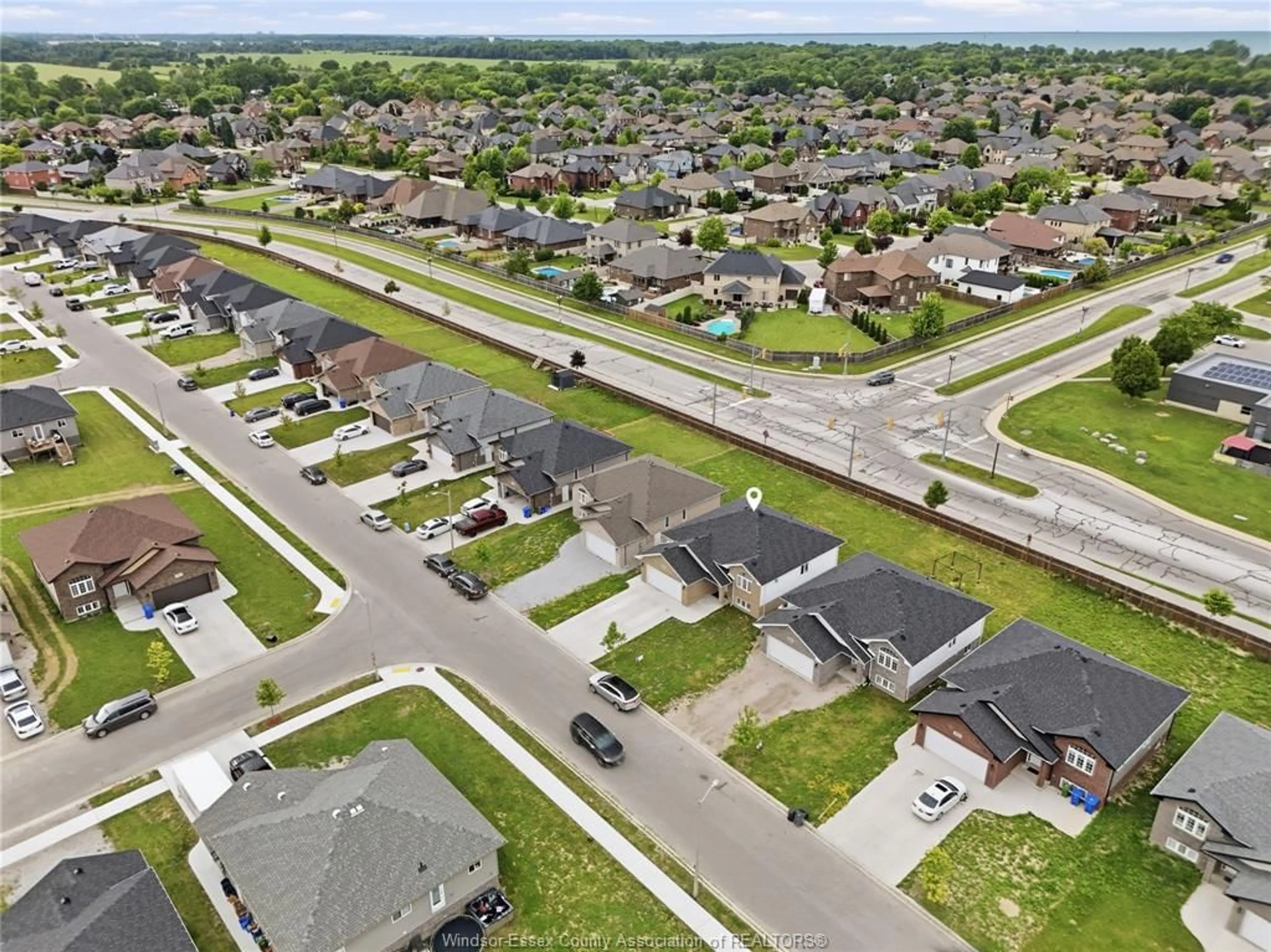 A pic from outside/outdoor area/front of a property/back of a property/a pic from drone, street for 1157 ASPEN RIDGE Cres, Lakeshore Ontario N0R 1A0