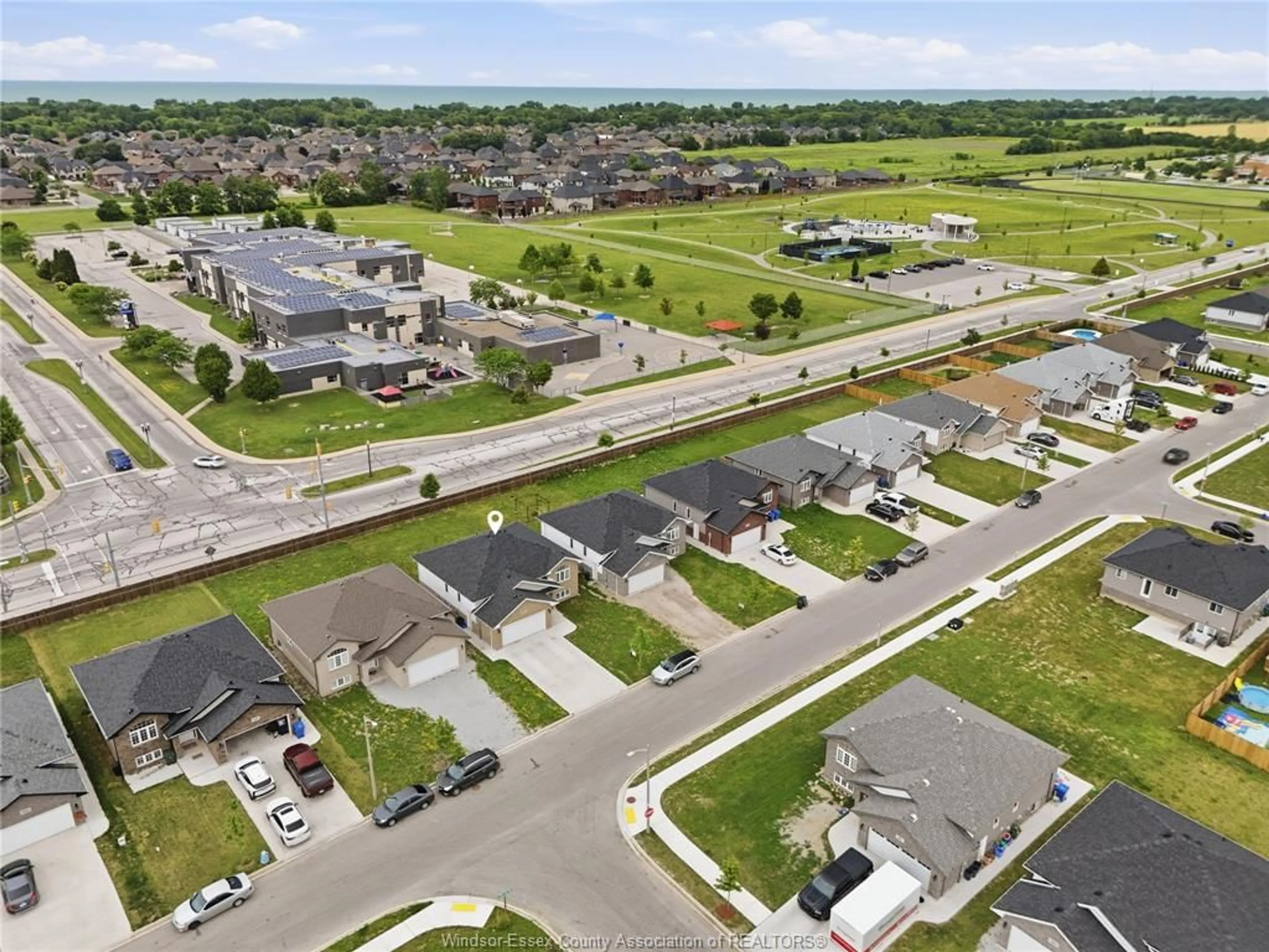 A pic from outside/outdoor area/front of a property/back of a property/a pic from drone, street for 1157 ASPEN RIDGE Cres, Lakeshore Ontario N0R 1A0