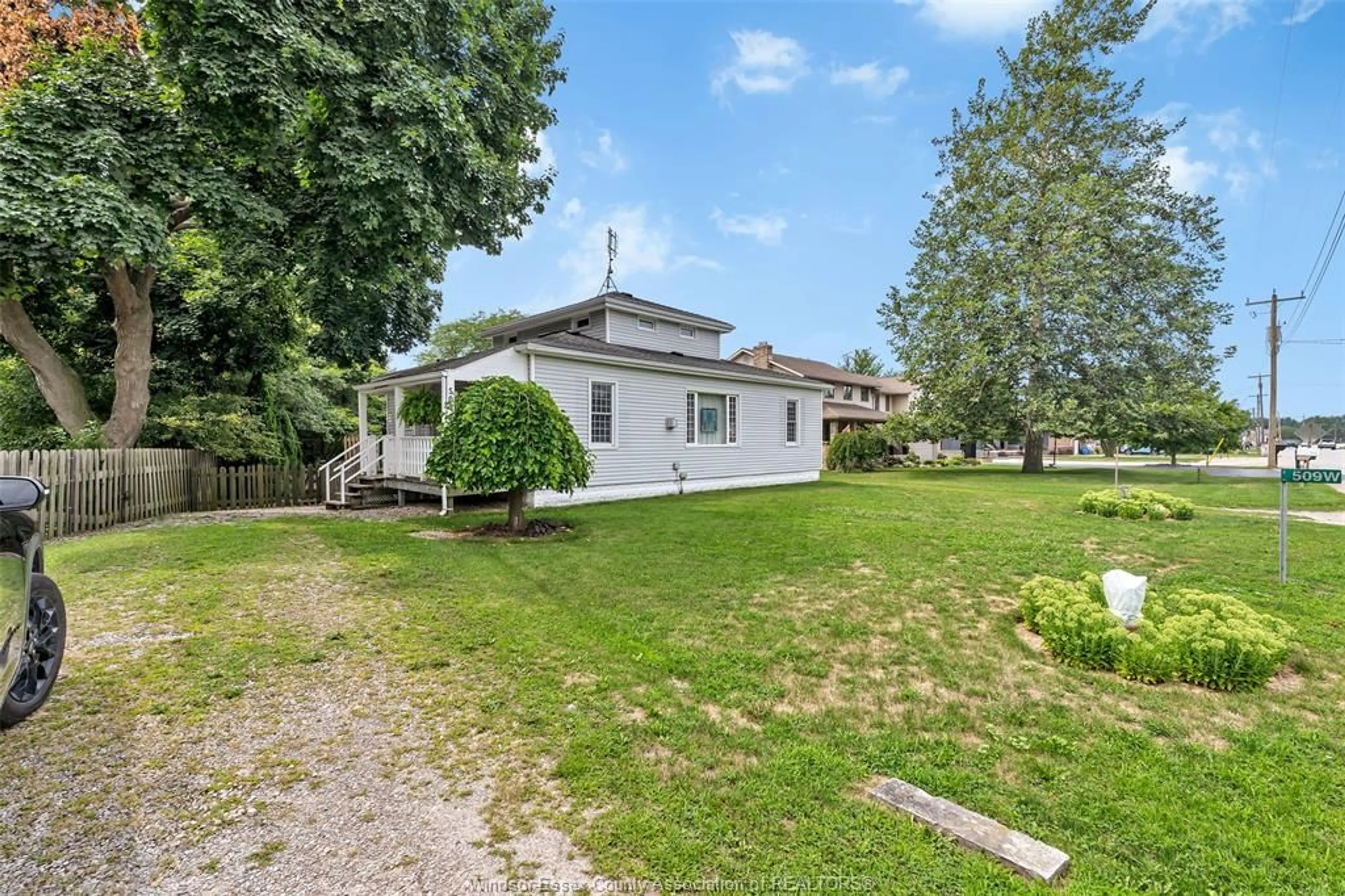 A pic from outside/outdoor area/front of a property/back of a property/a pic from drone, street for 509 COUNTY RD 34, Kingsville Ontario N8M 2X5