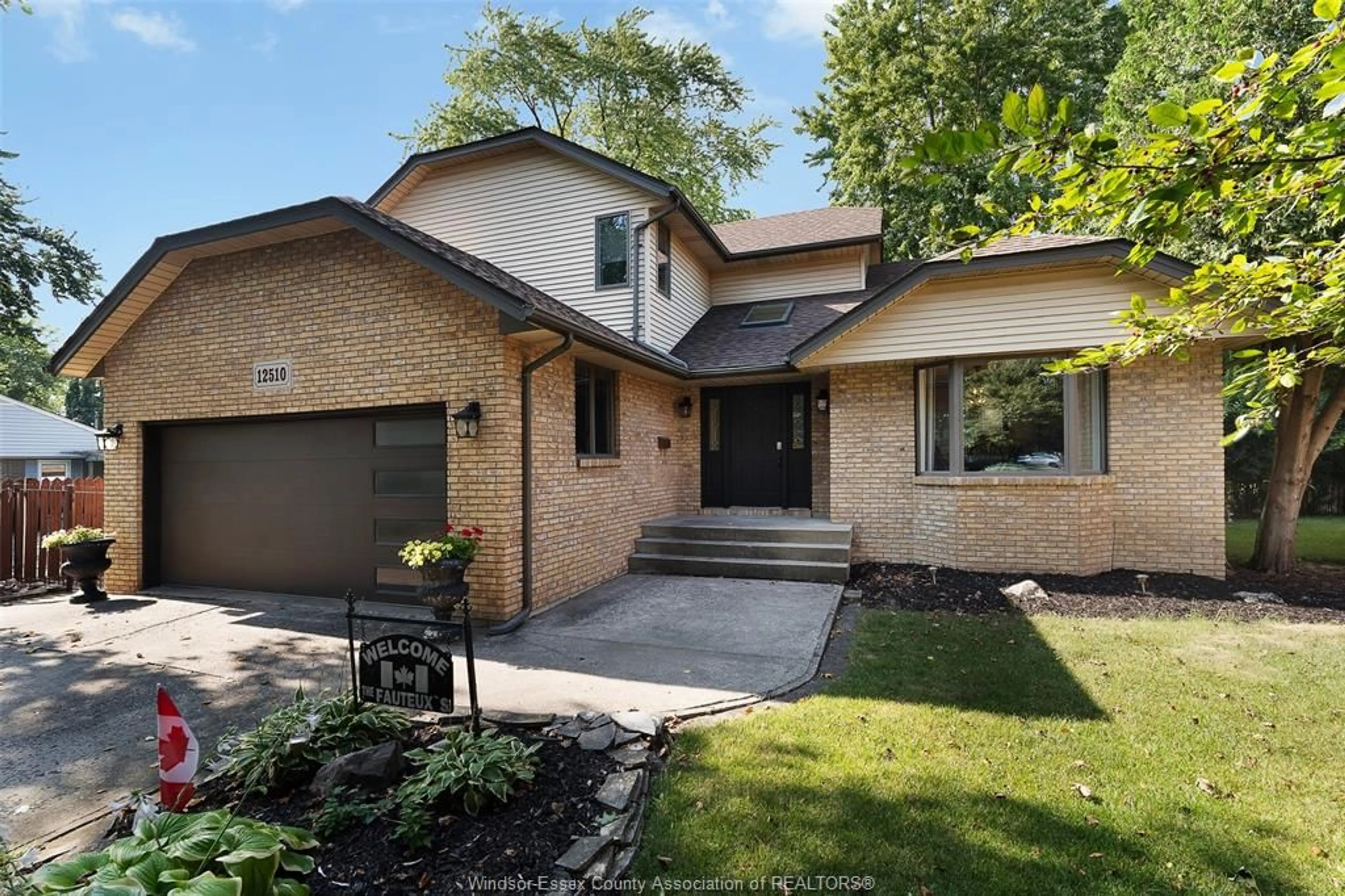 Home with brick exterior material, street for 12510 KEITH Cres, Tecumseh Ontario N8N 4A8