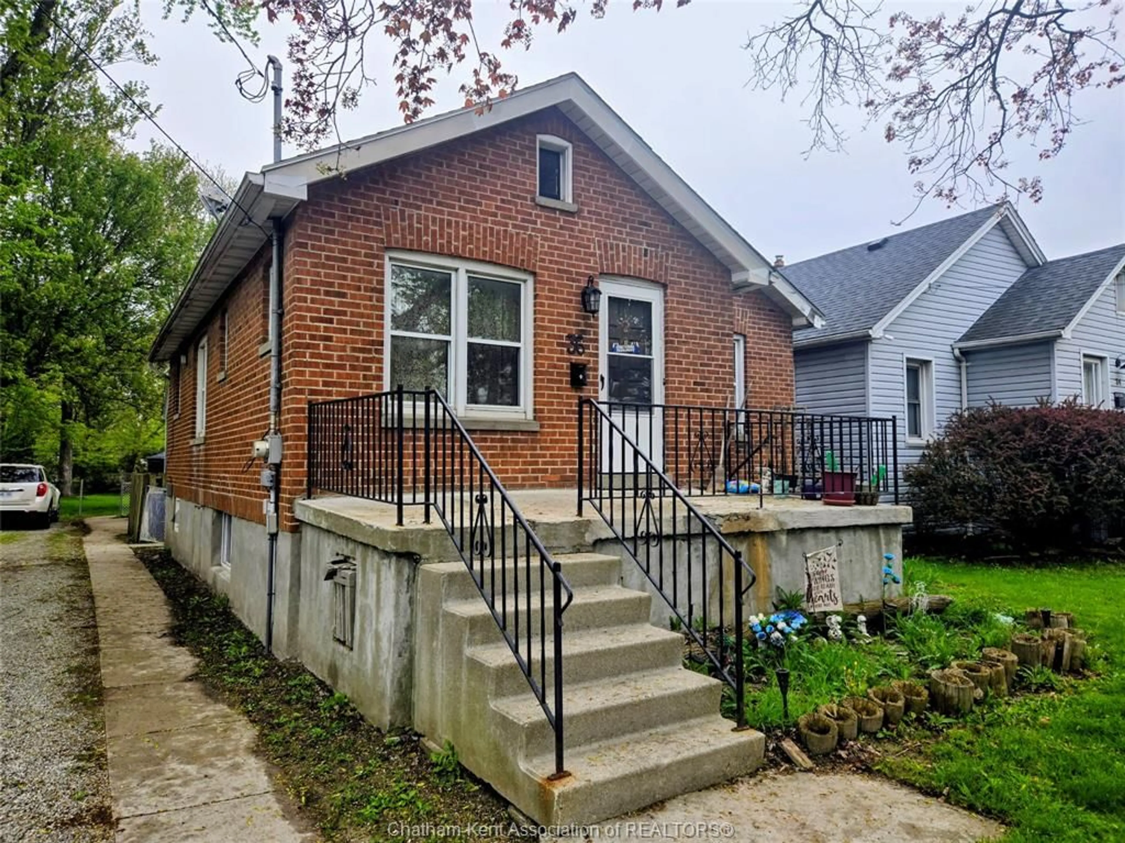 Home with brick exterior material, street for 36 McNaughton Ave E Ave, Chatham Ontario N7L 2G1