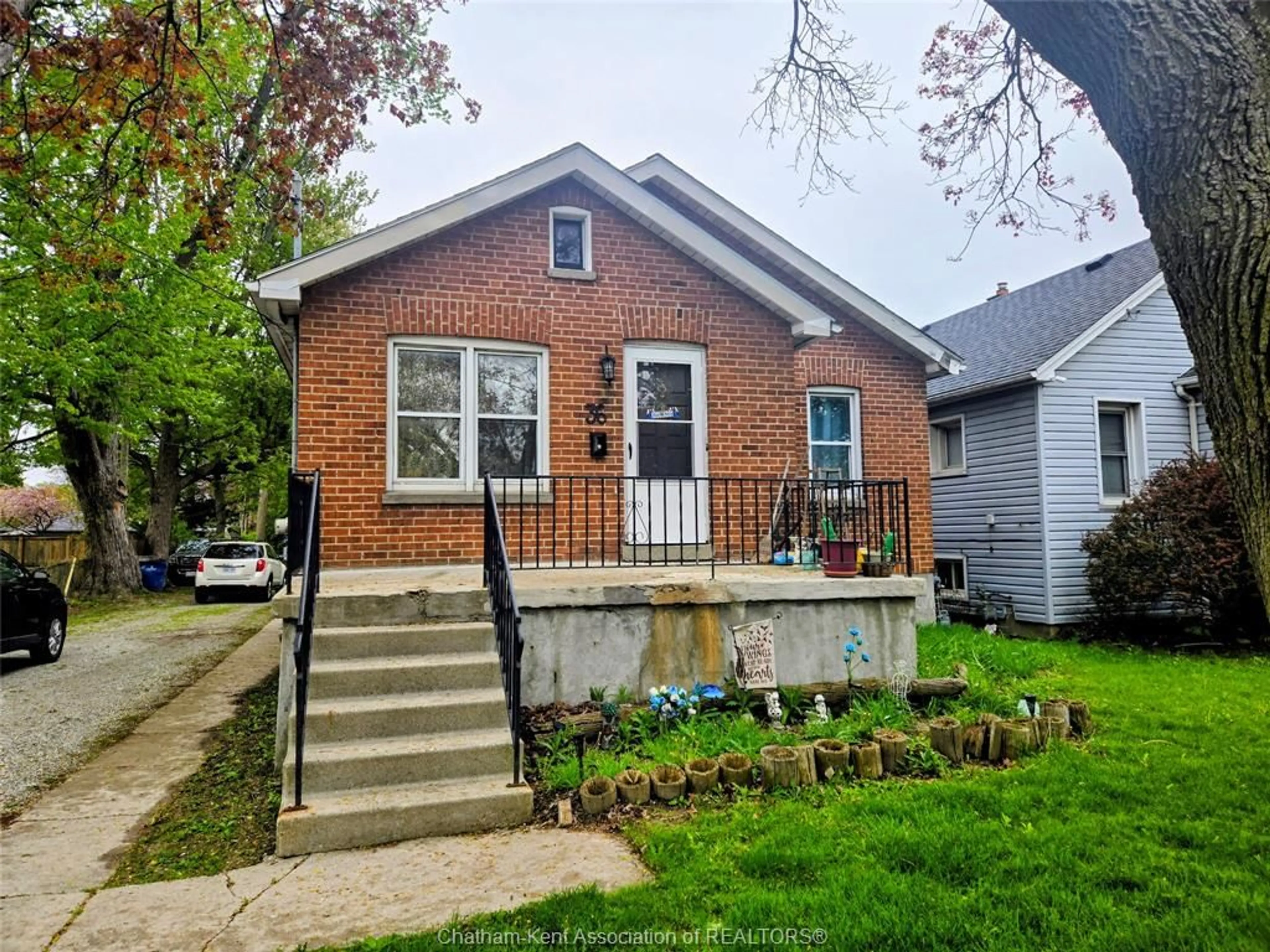 Home with brick exterior material, street for 36 McNaughton Ave E Ave, Chatham Ontario N7L 2G1