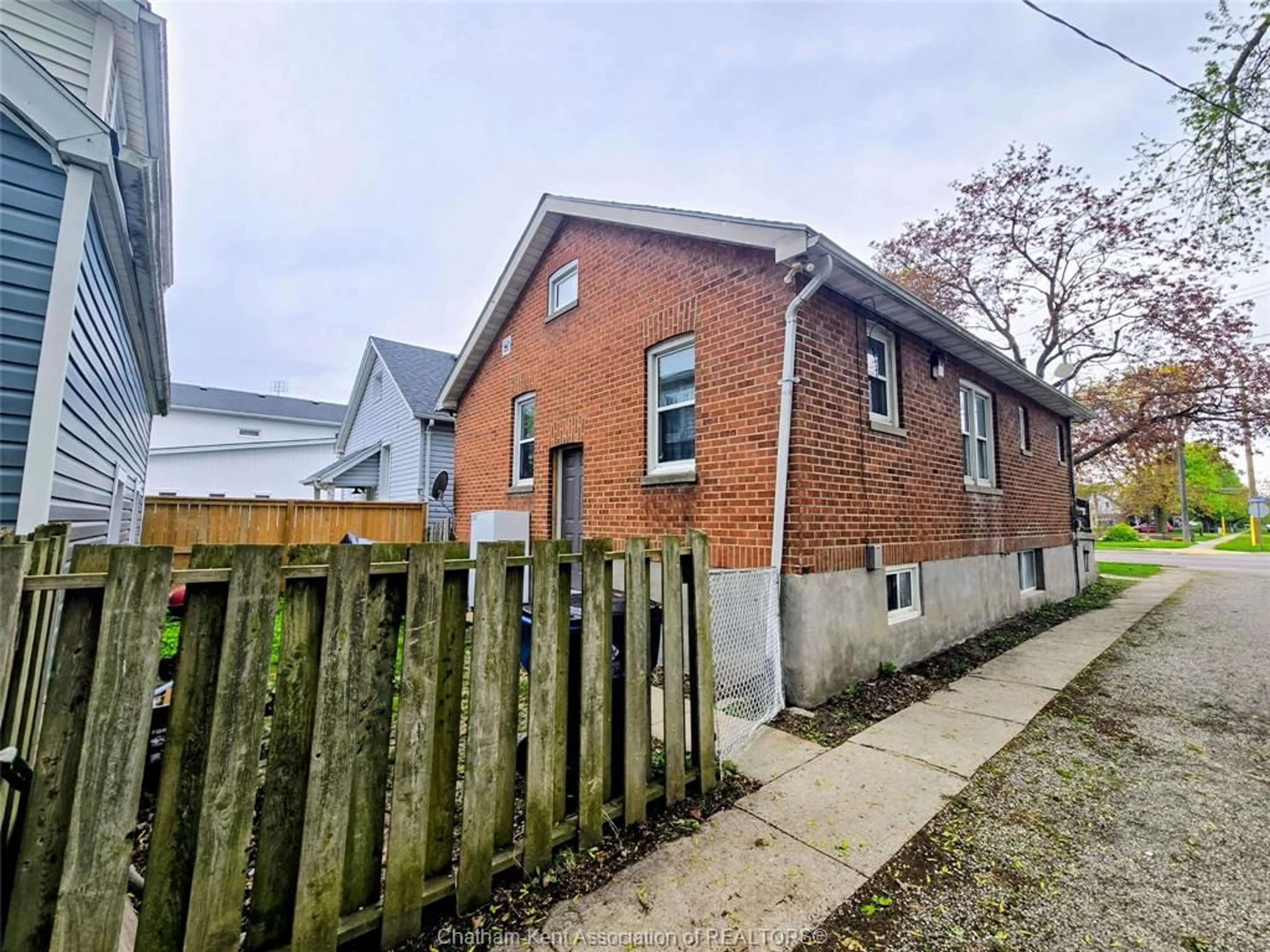 Home with brick exterior material, street for 36 McNaughton Ave E Ave, Chatham Ontario N7L 2G1