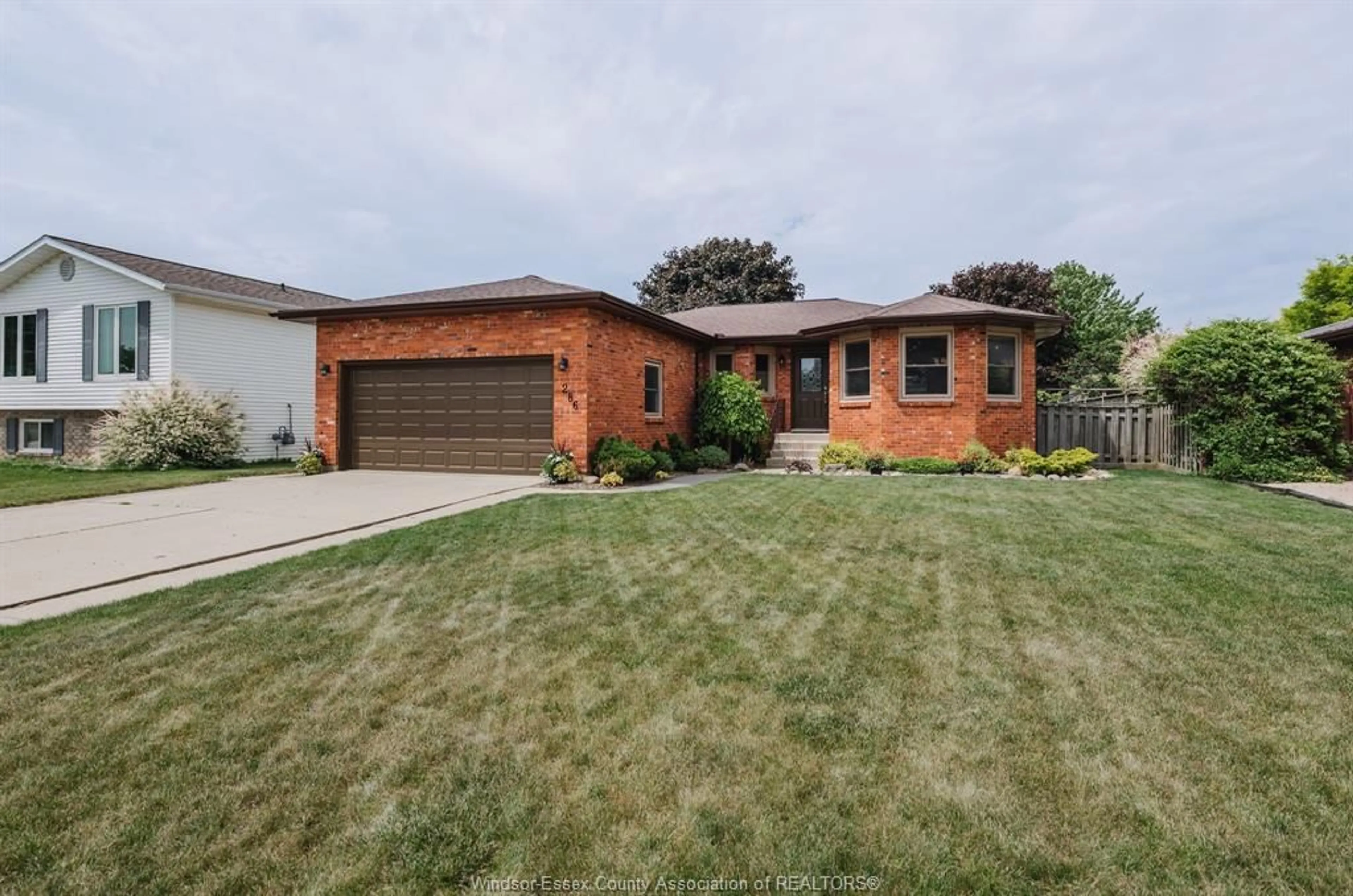 Home with brick exterior material, street for 286 Cherrywood Drive, Kingsville Ontario N9Y 3R4