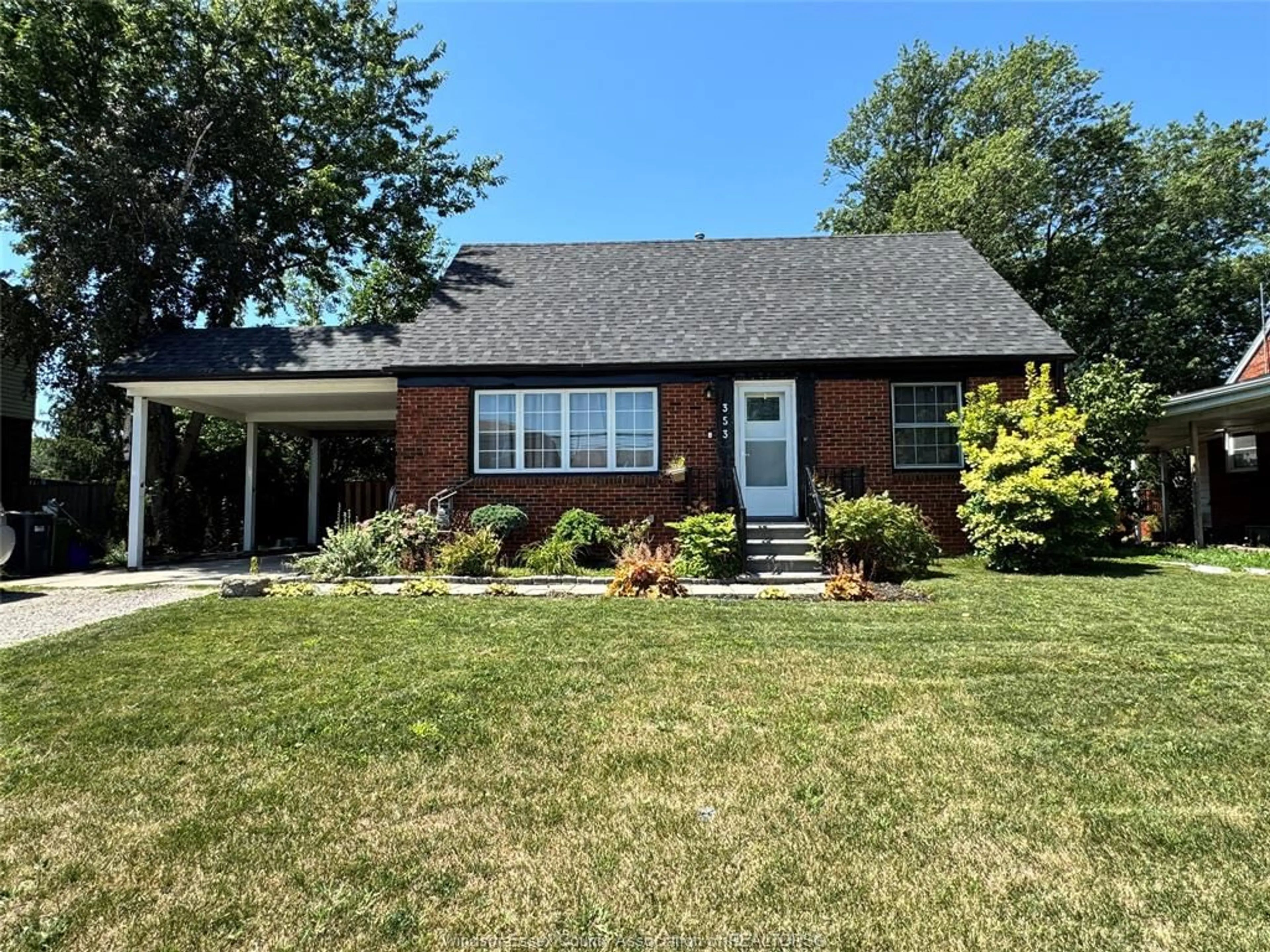 Home with brick exterior material, street for 353 LAUZON Rd, Windsor Ontario N8S 3M1