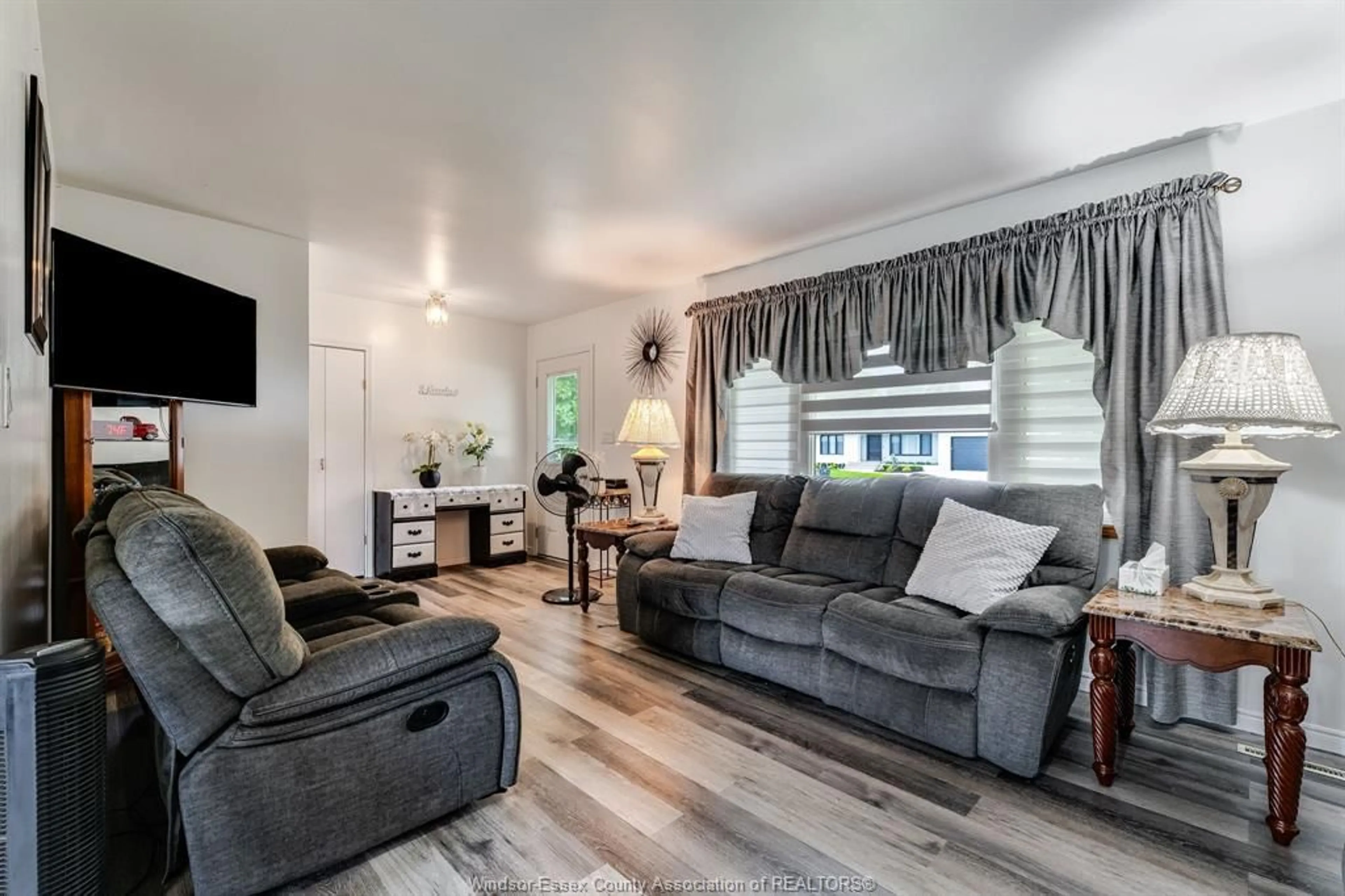 Living room with furniture, wood/laminate floor for 1665 REGENT St, Ruthven Ontario N0P 2G0