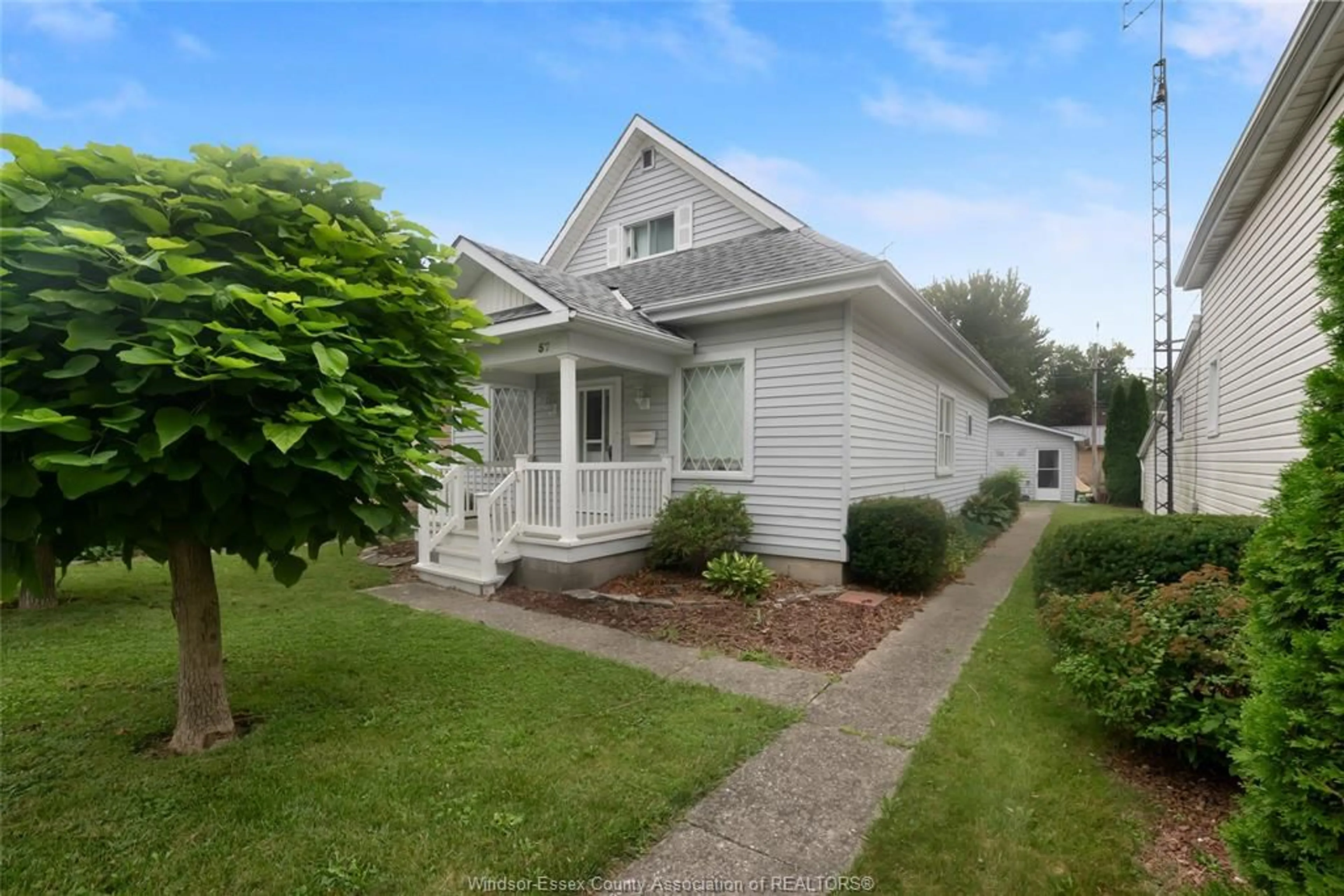 Home with vinyl exterior material, street for 57 Canal St, Tilbury Ontario N0P 2L0