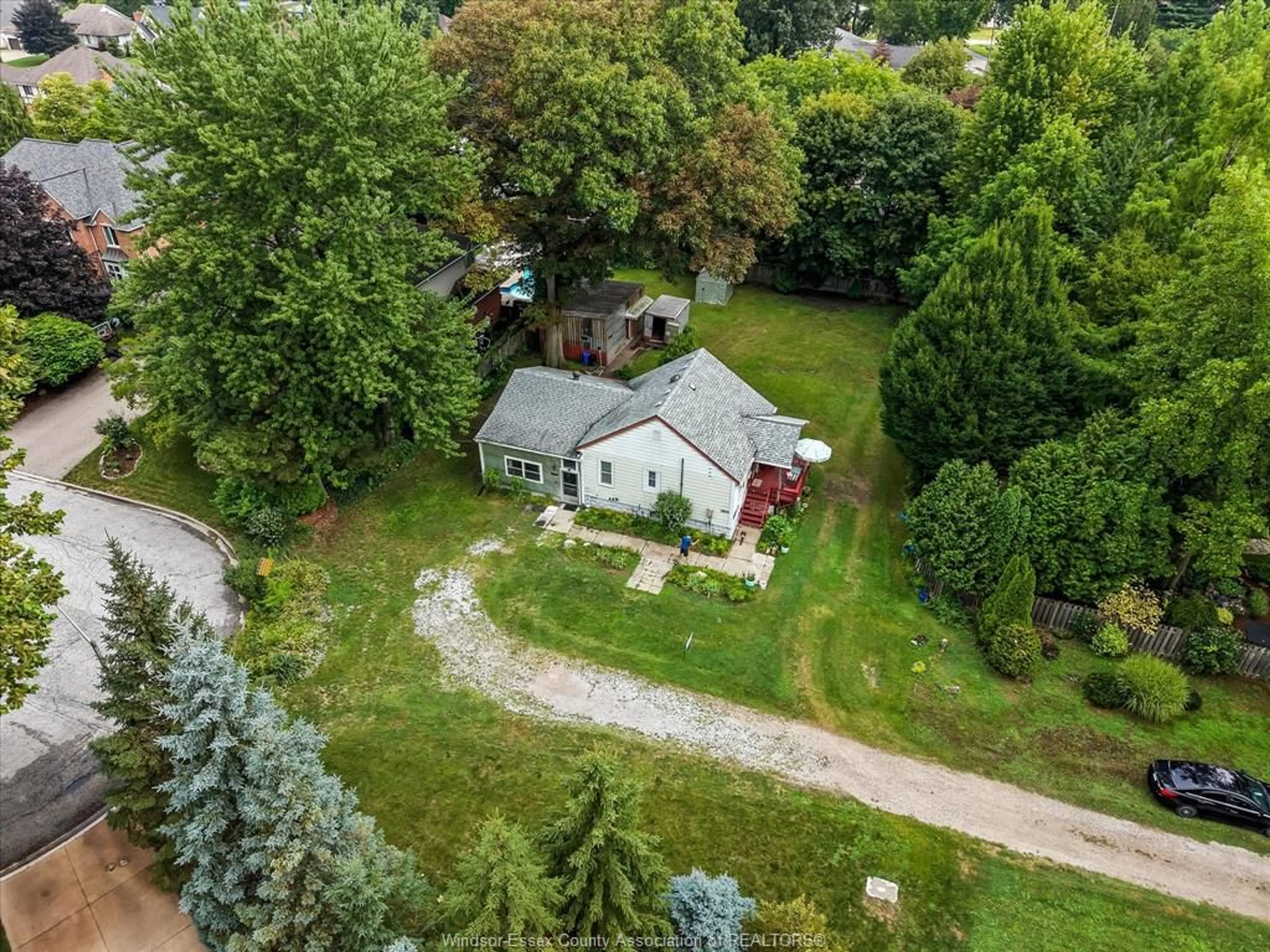 A pic from outside/outdoor area/front of a property/back of a property/a pic from drone, street for 7035 MATCHETTE Rd, LaSalle Ontario N9J 2S1