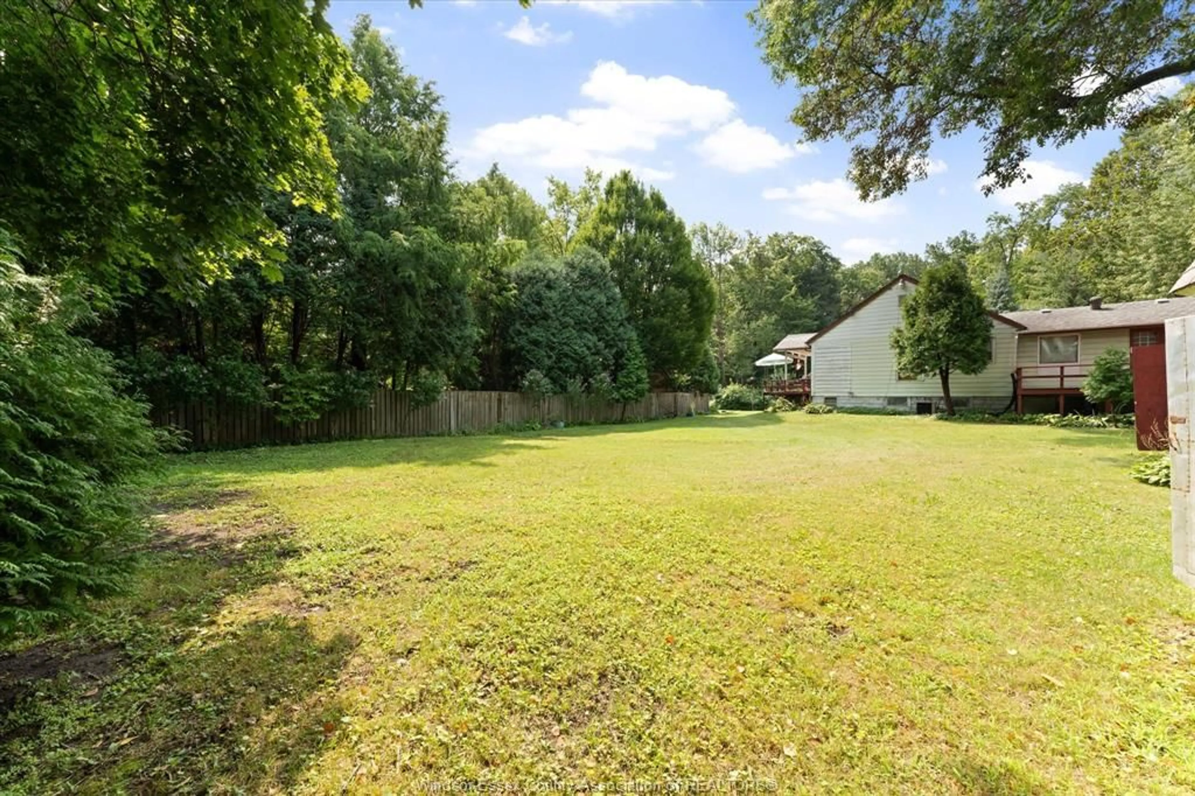 A pic from outside/outdoor area/front of a property/back of a property/a pic from drone, forest/trees view for 7035 MATCHETTE Rd, LaSalle Ontario N9J 2S1