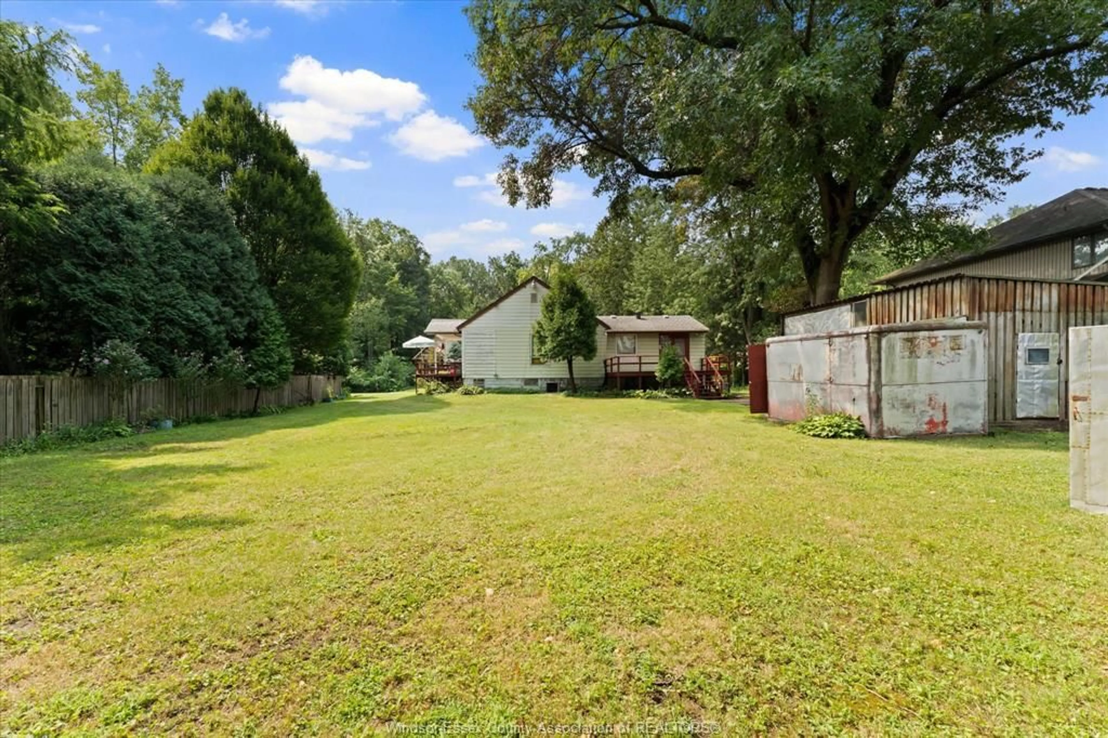 A pic from outside/outdoor area/front of a property/back of a property/a pic from drone, forest/trees view for 7035 MATCHETTE Rd, LaSalle Ontario N9J 2S1
