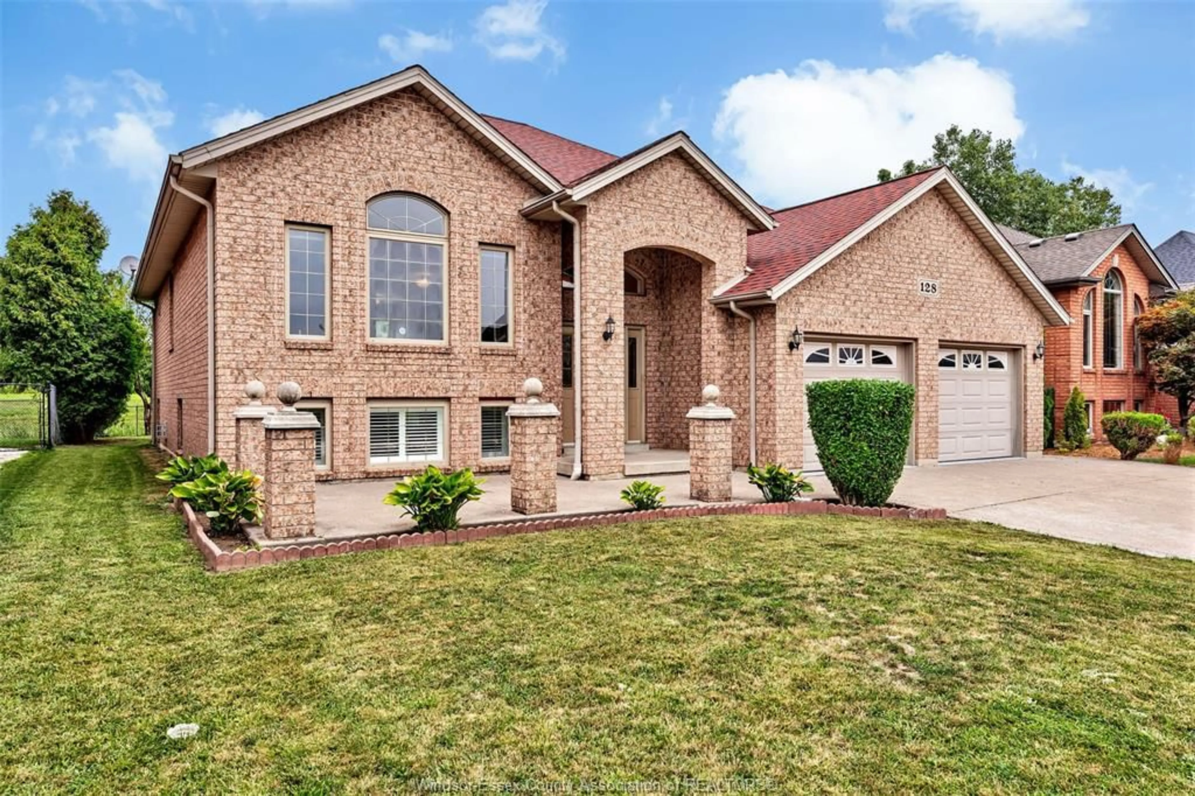 Home with brick exterior material, street for 128 MARINA GROVE, Lakeshore Ontario N9K 1C9