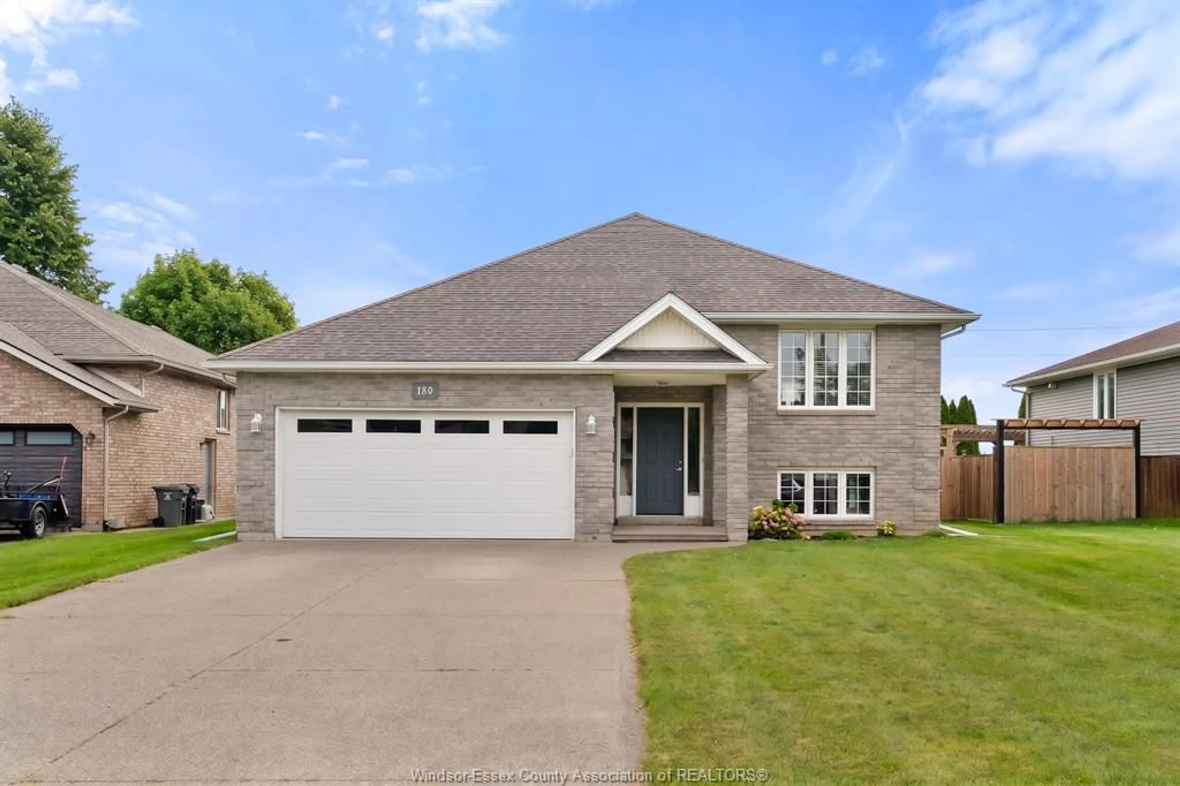 Home with brick exterior material, street for 180 Sunset Dr, Harrow Ontario N0R 1G0