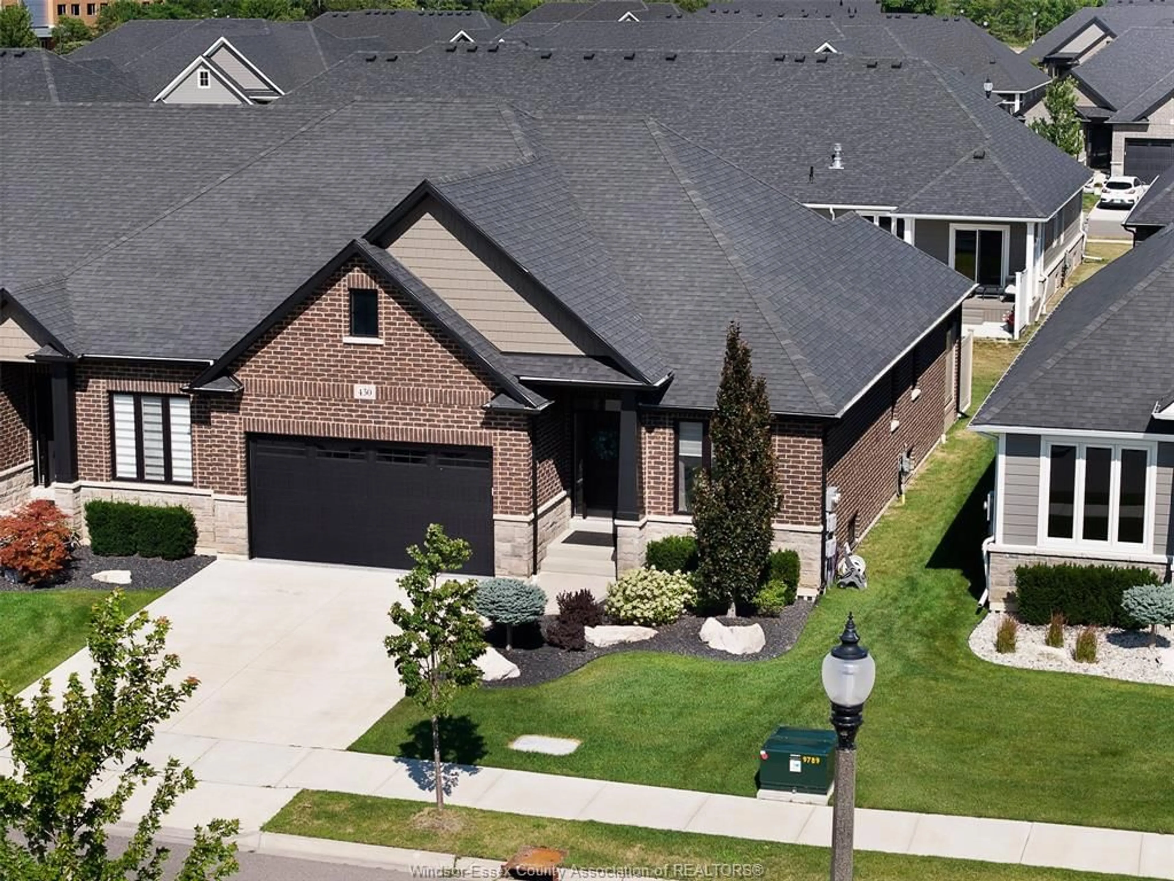 Home with brick exterior material, street for 450 BRUNMAR Cres, Lakeshore Ontario N8L 0Y2