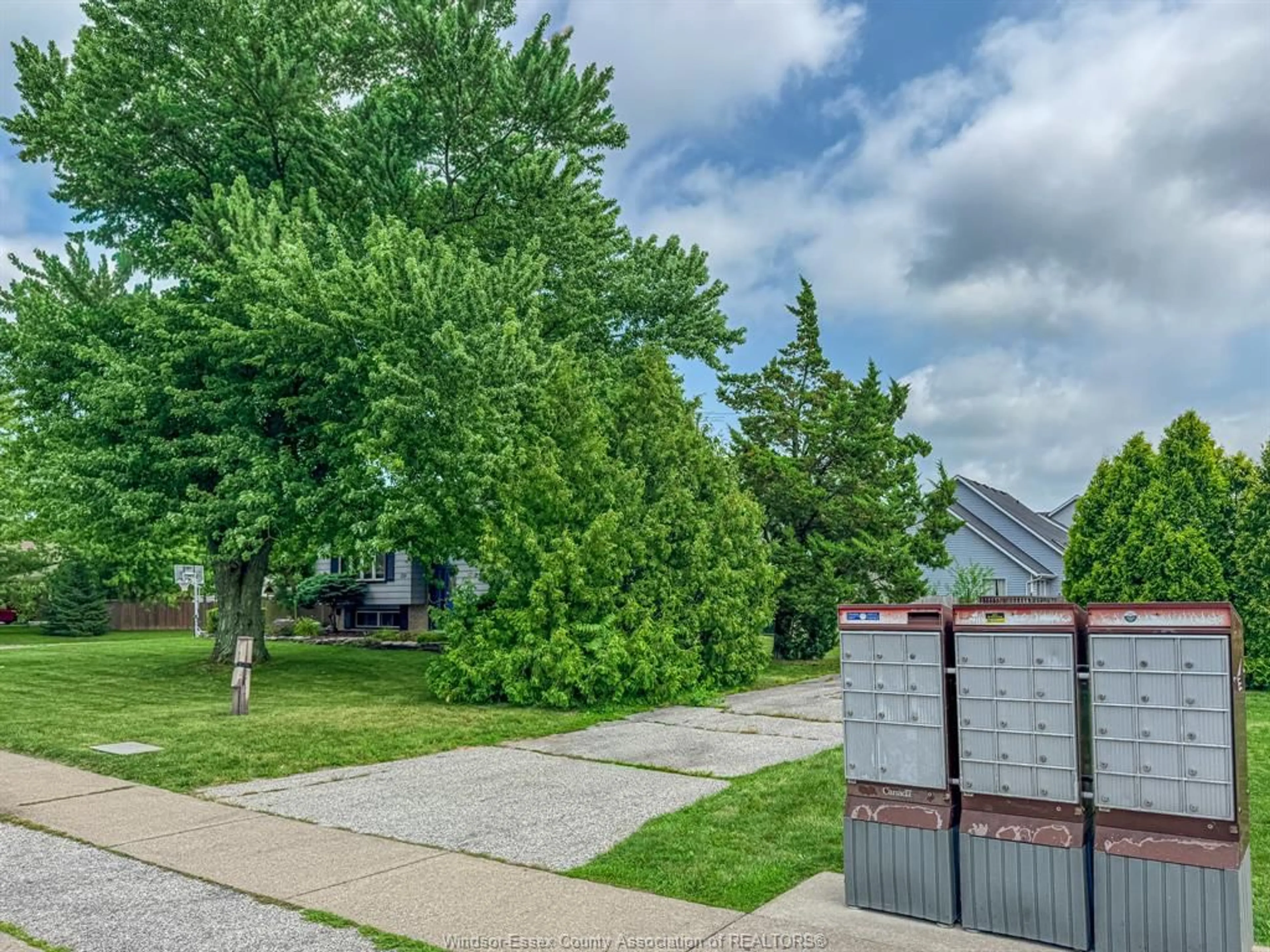 A pic from outside/outdoor area/front of a property/back of a property/a pic from drone, street for 159 DUCHARME, Lakeshore Ontario N0R 1A0