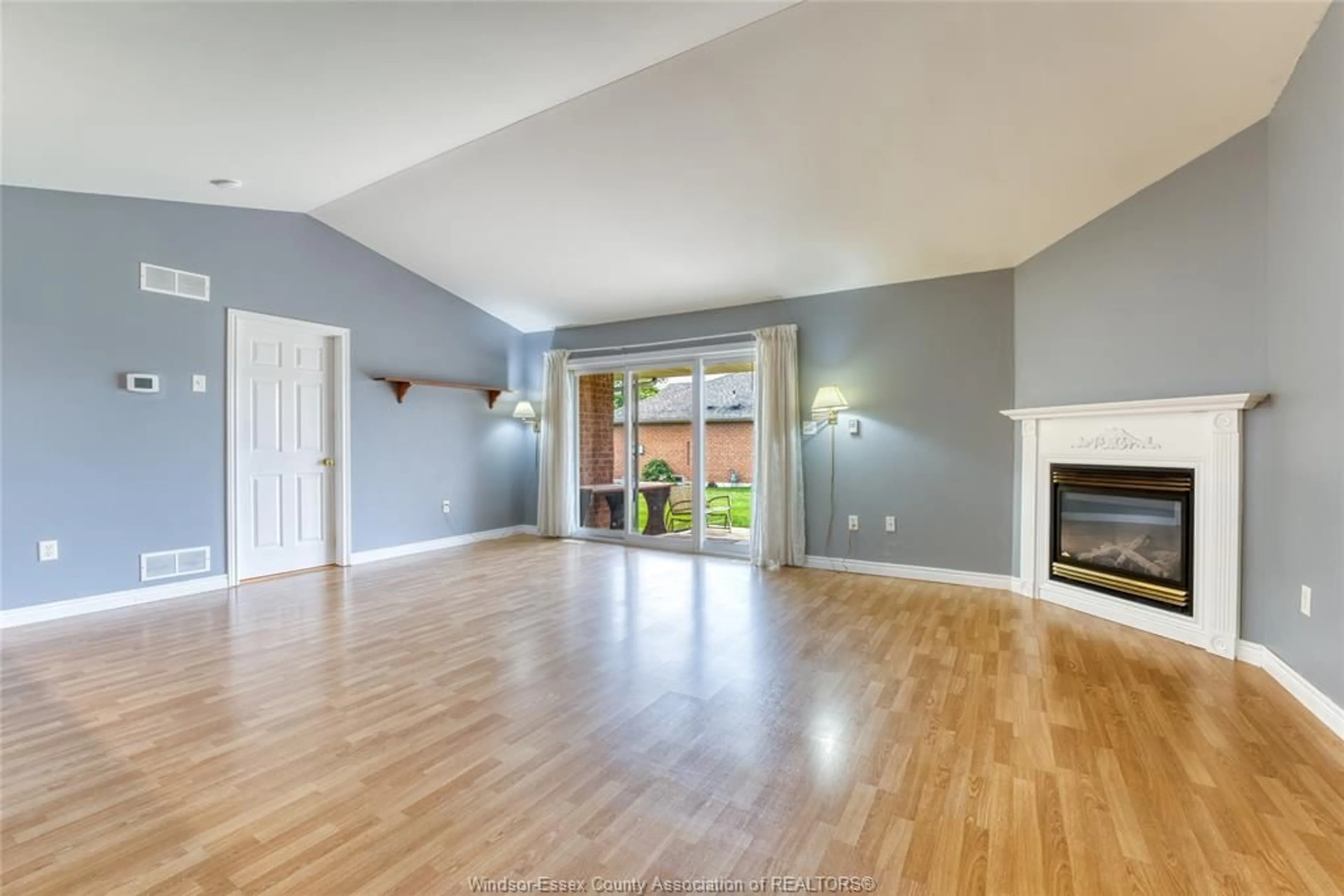 Living room with furniture, wood/laminate floor for 11181 FIRGROVE, Windsor Ontario N8P 1M6