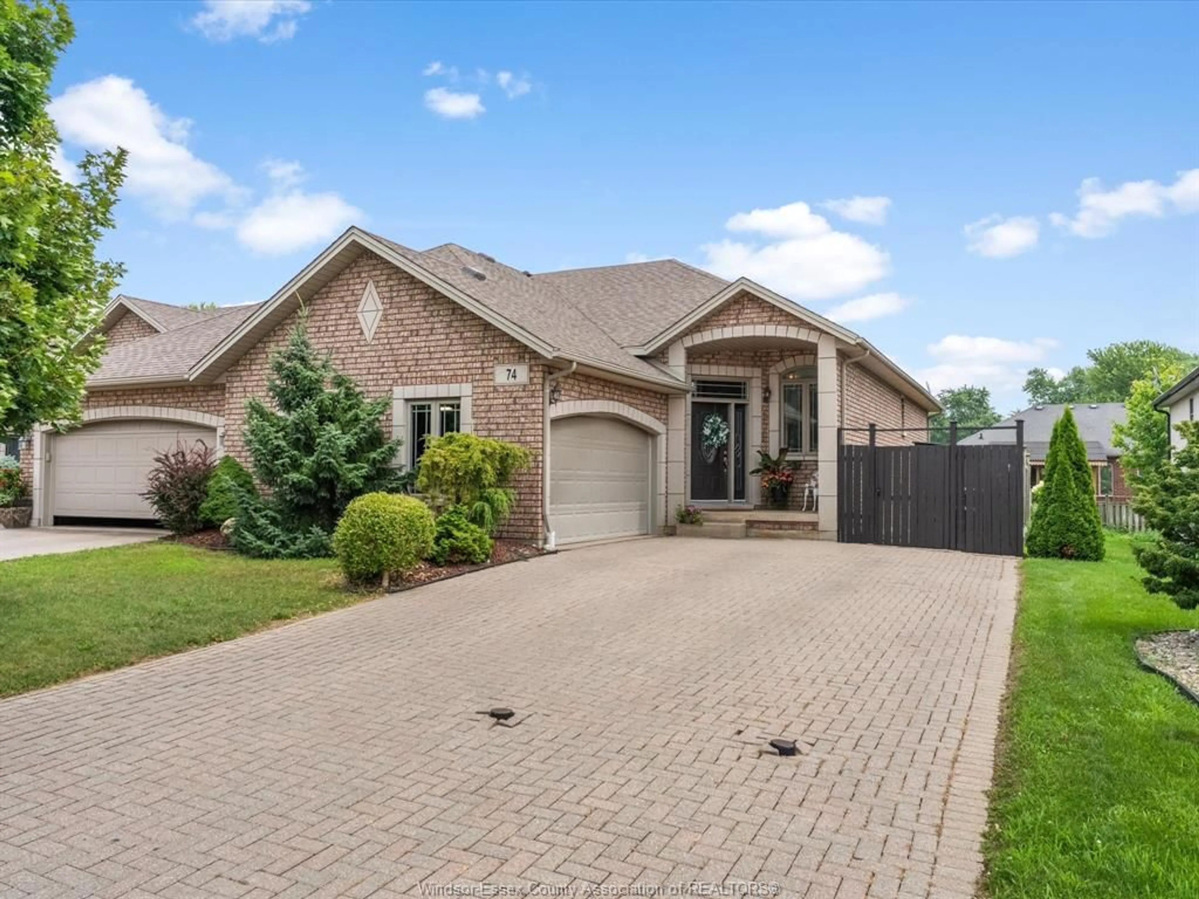 Home with brick exterior material, street for 74 CAROLINA WOODS, Leamington Ontario N8H 5N3