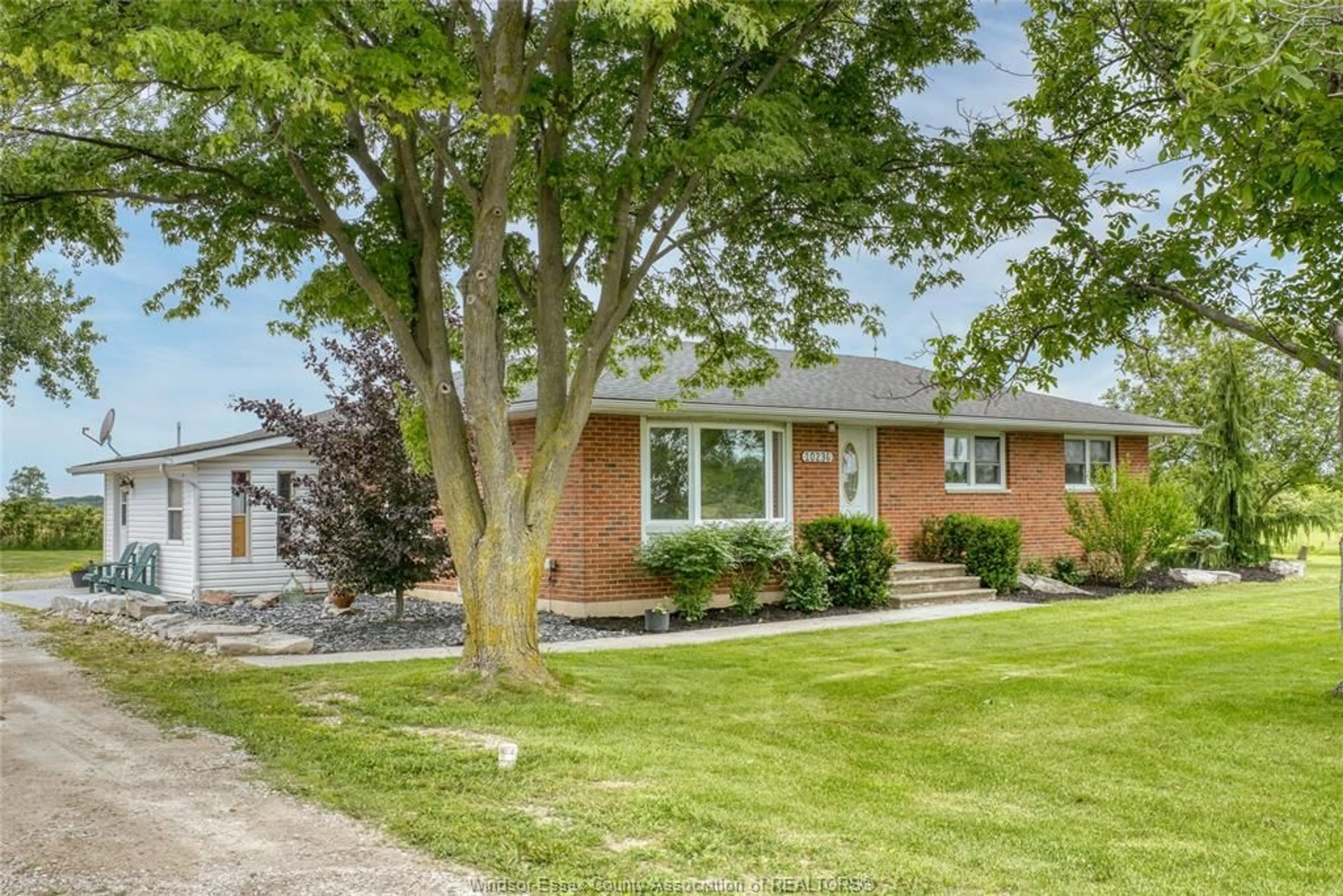Home with brick exterior material, street for 10236 COUNTY RD 11, Amherstburg Ontario N0R 1J0