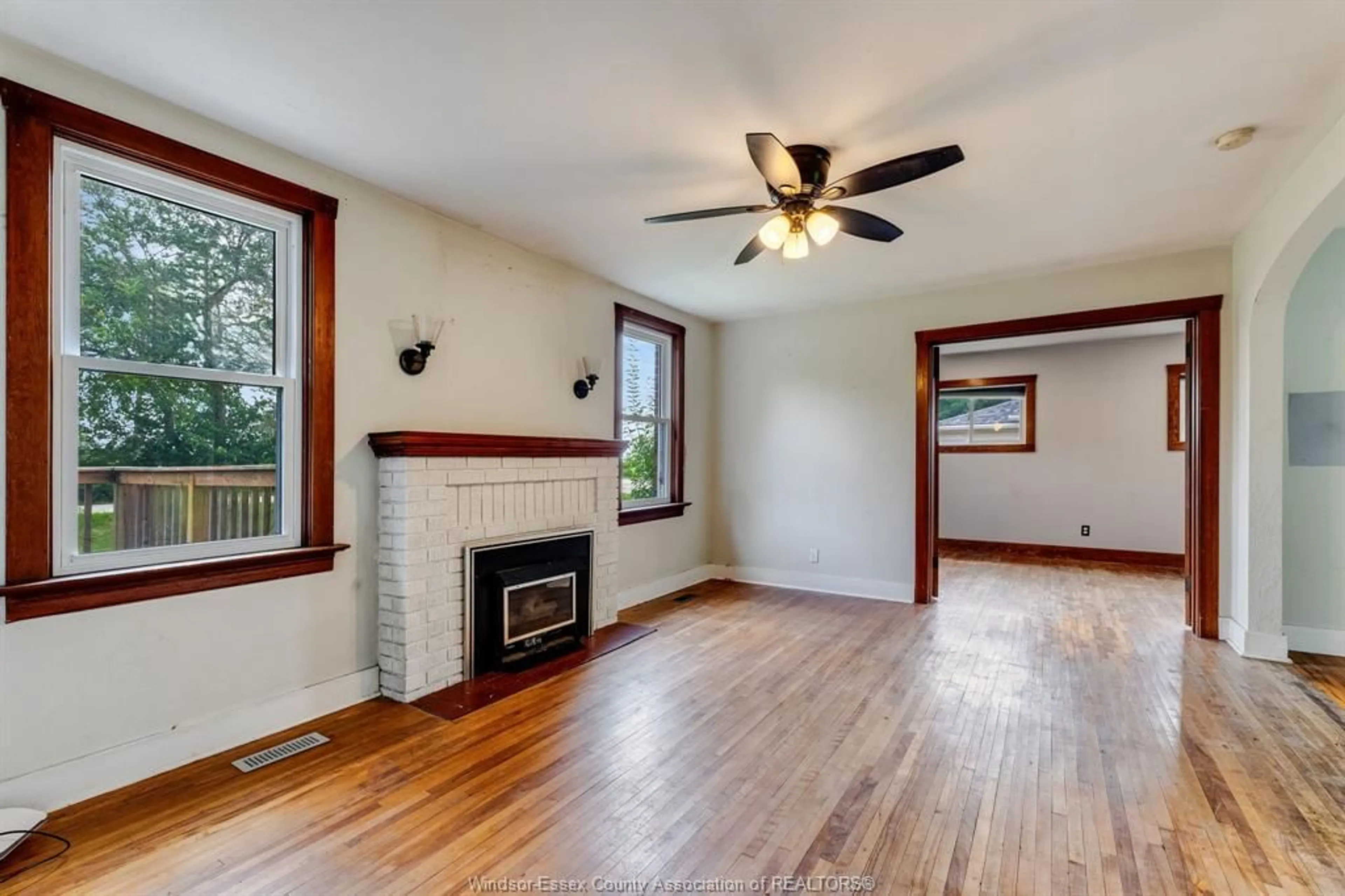 Living room with furniture, wood/laminate floor for 24528 Dashwheel Rd, Tilbury Ontario N0P 2L0